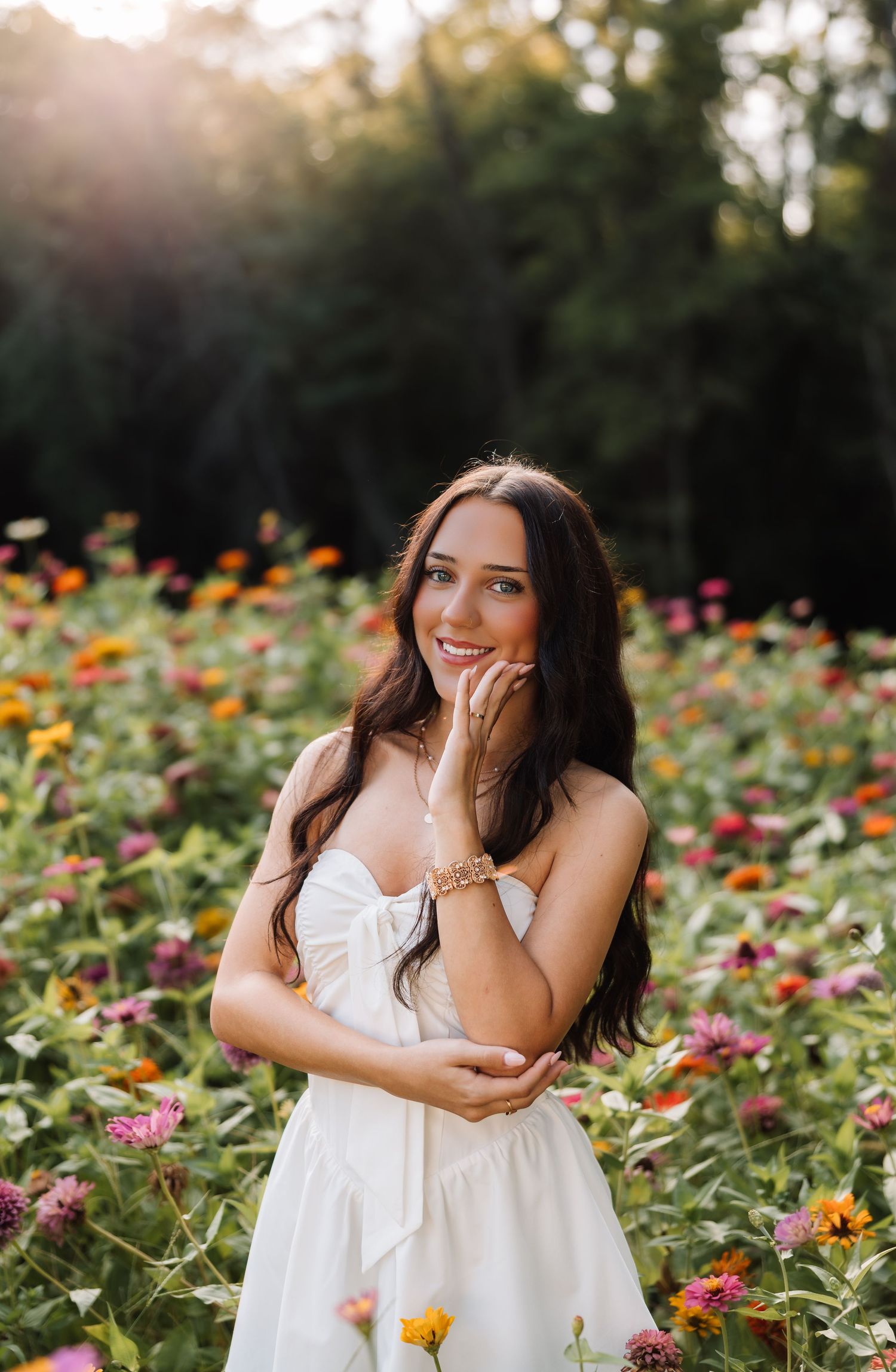 Senior photographer located throughout the Kansas City Metro area. Based in Blue Springs, Missouri. Senior in flower field.
