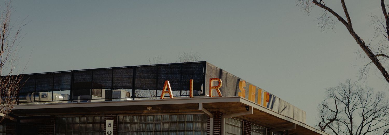 Aesthetic exterior architectural photography of Airship Coffee at the Pumphouse in Bentonville, AR by Tyler Banner Photography.