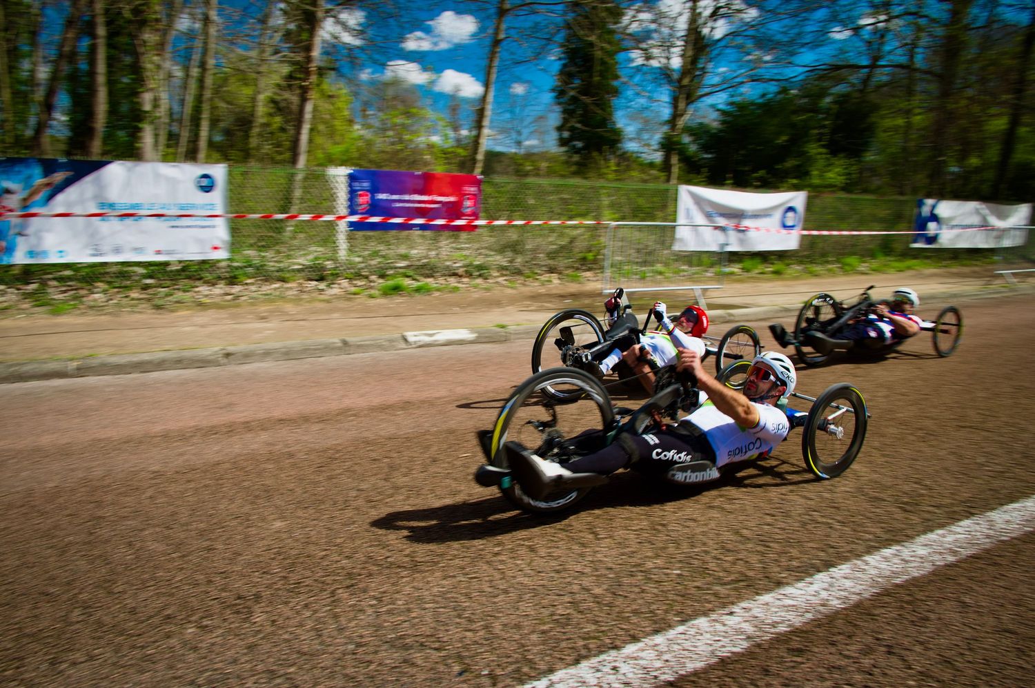 Mathieu Bosredon of Team Cofidis racing against Joseph Frisch at the 2025 Paracycling event at Paris-Longchamp