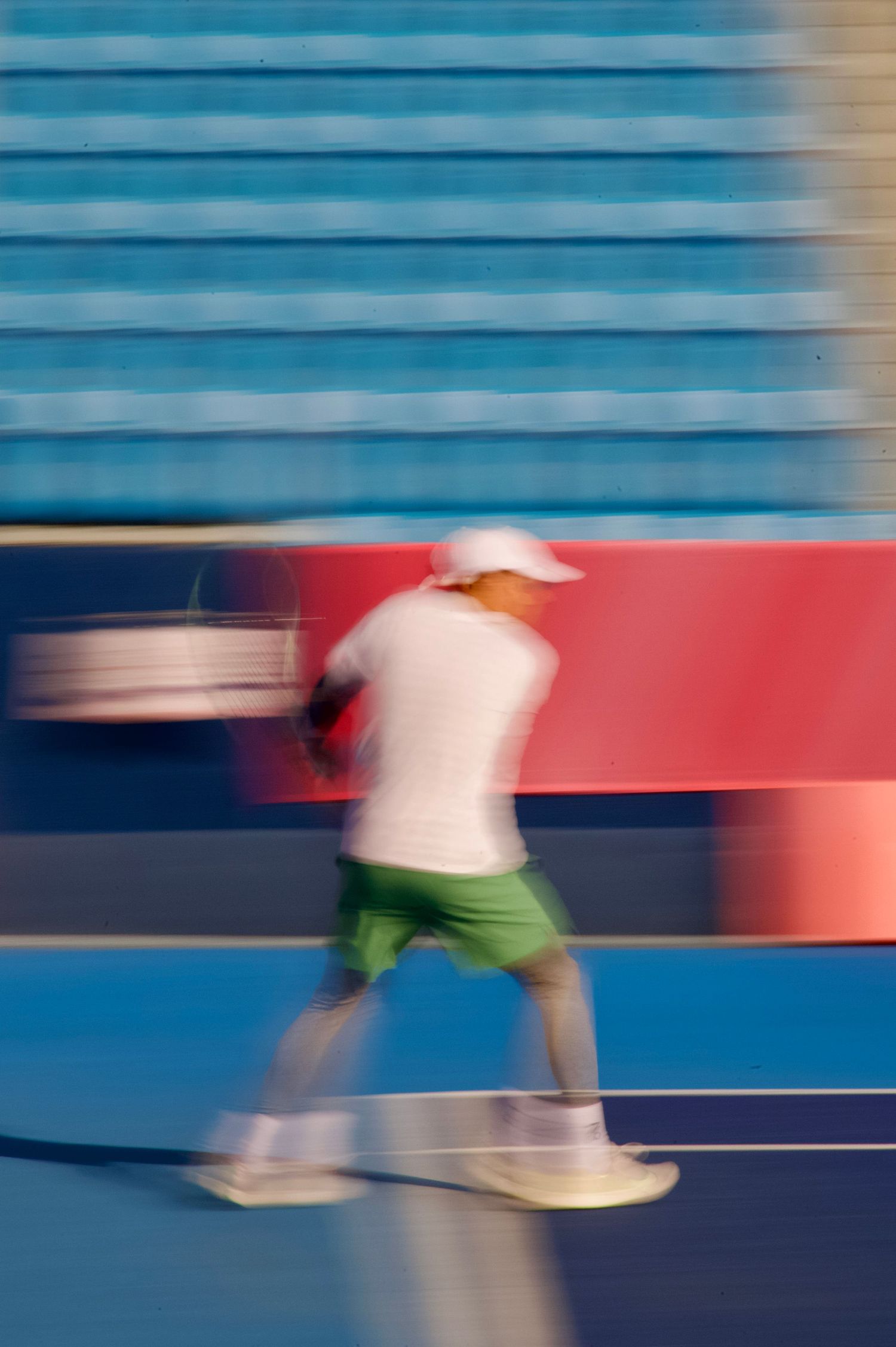 Motion blur photo of doubles tennis match at the 2025 Deaflympics in Tokyo