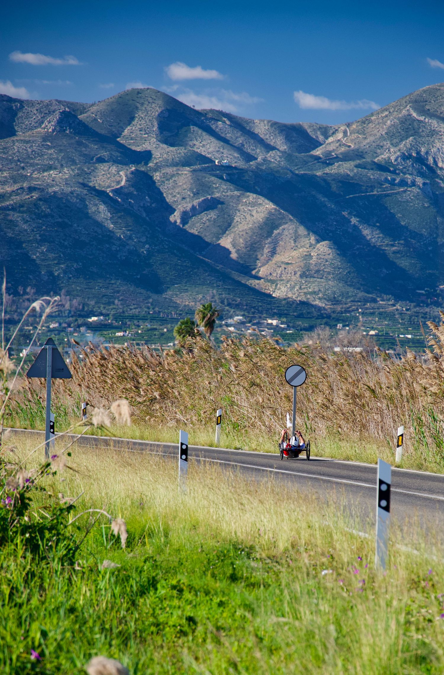 Mathieu Bosredon Team Cofidis Paracycling, during a training ride near Pego with prominent mountains and marshland