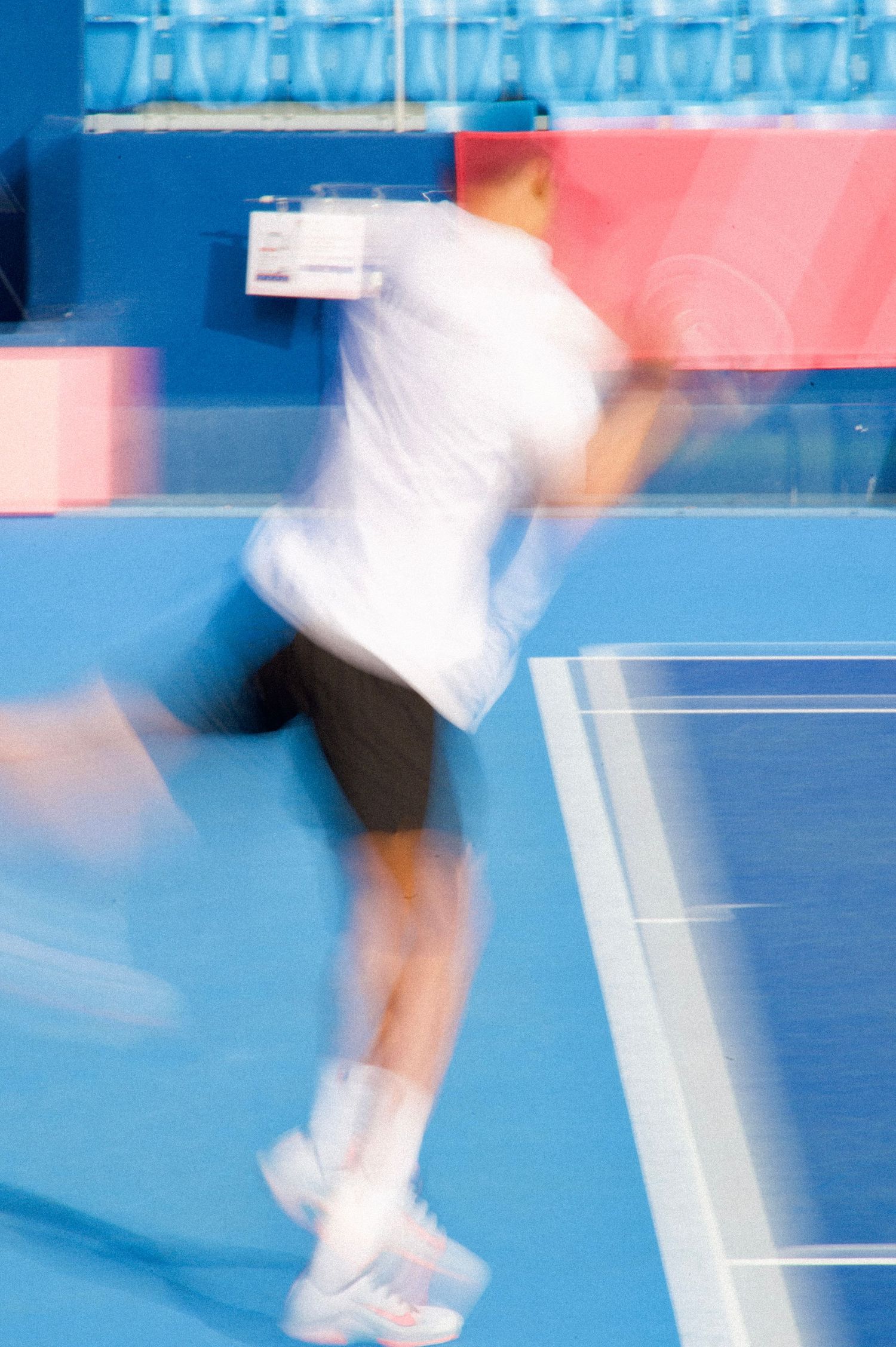 Motion blur of tennis player serving at the 2025 Deaflympics in Tokyo