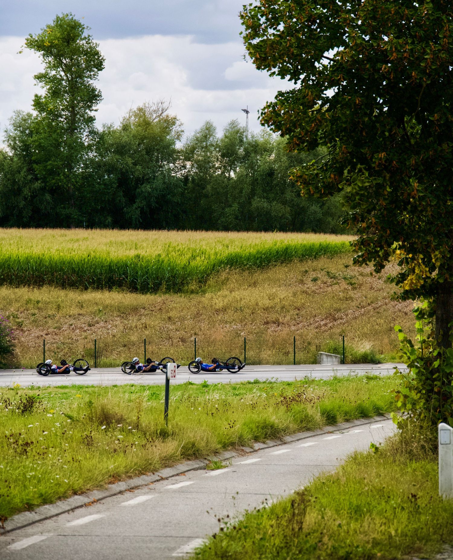 A trio of hand cyclists, including Mathieu Bosredon at the 2025 UCI world championships in Ronse, Belgium