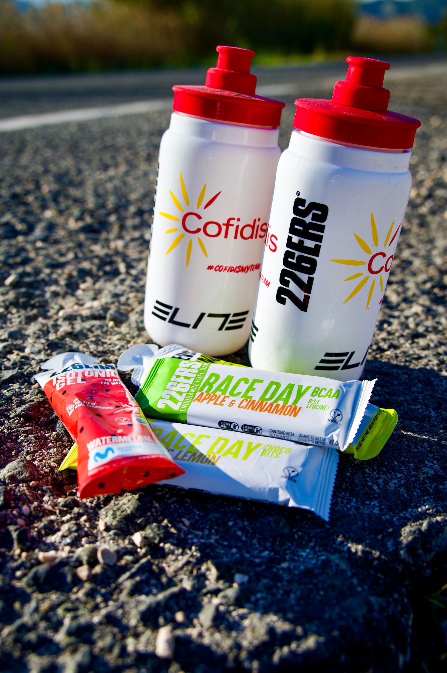 Close up of 2 Elite water bottles with a selection of 226ERS nutritional products