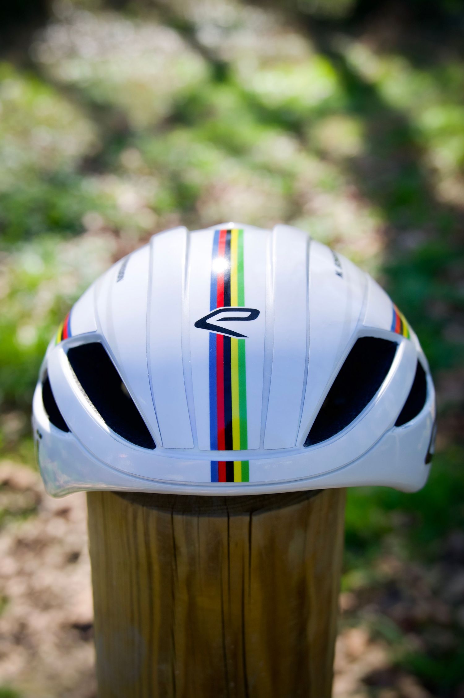 Close up of Mathieu Bosredon's rainbow, world champion bands on his Ekoi Helmet.
