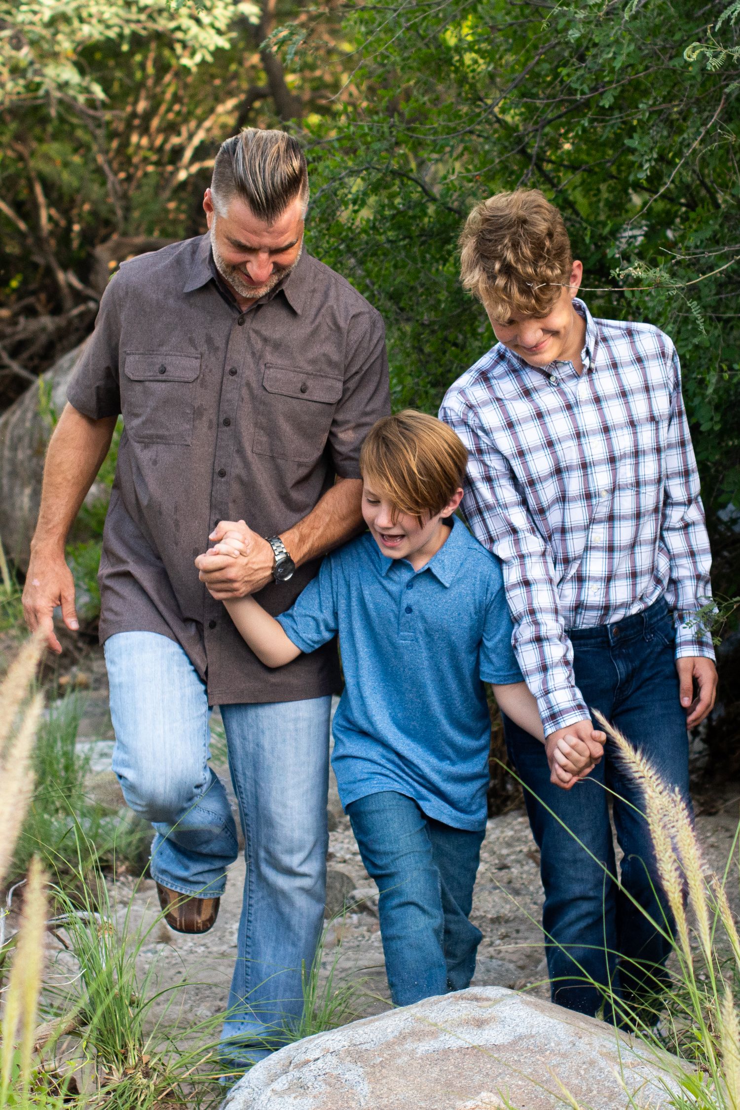 Family walking by a stream in Tucson AZ.