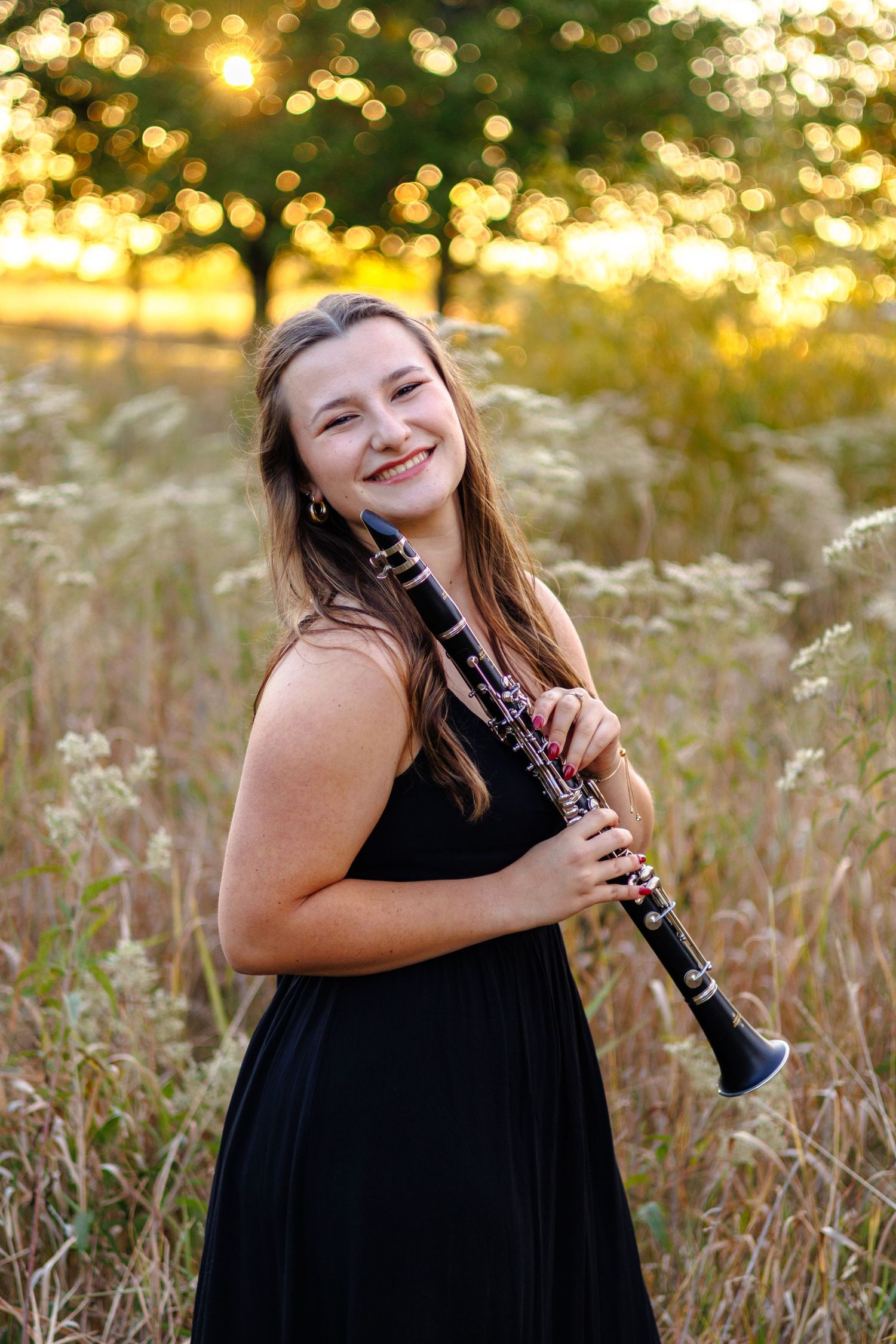 A senior portrait holding a clarinet in Bourbonnais, Illinois