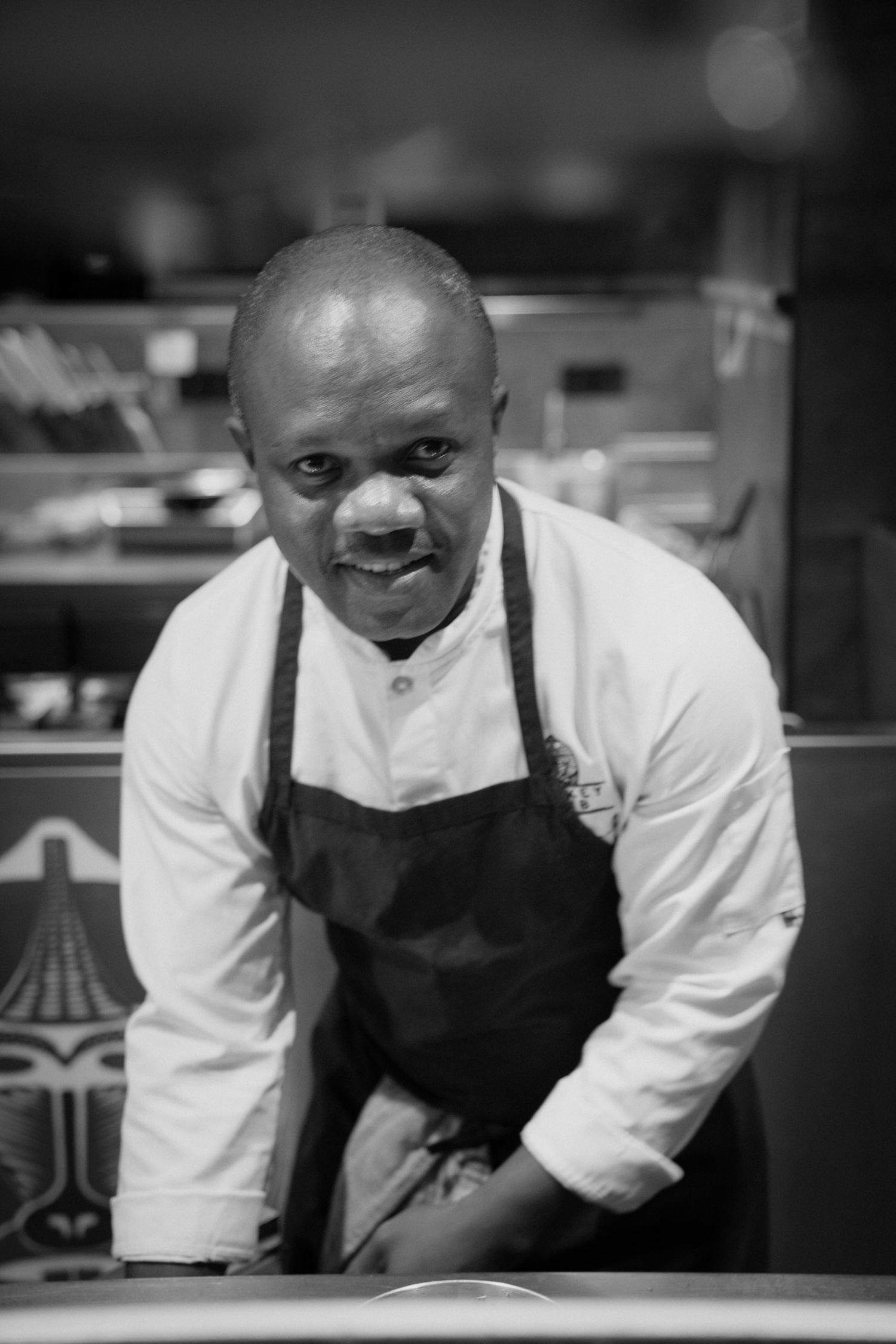 Portrait of a chef in a Málaga restaurant, photographed with natural light and a calm, professional atmosphere.