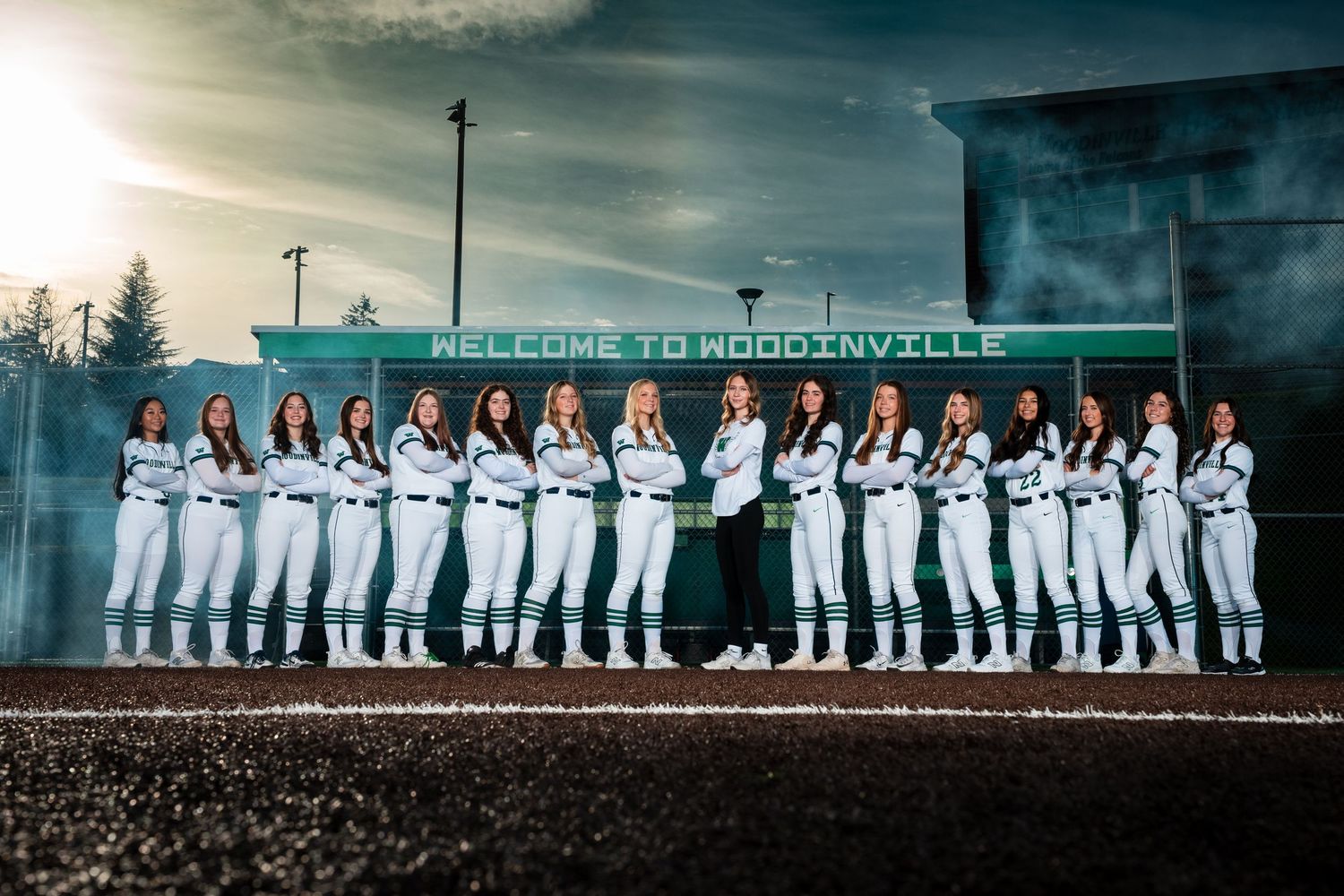A panoramic series of sports team photos showing players in white uniforms posing together against various outdoor backgrounds.