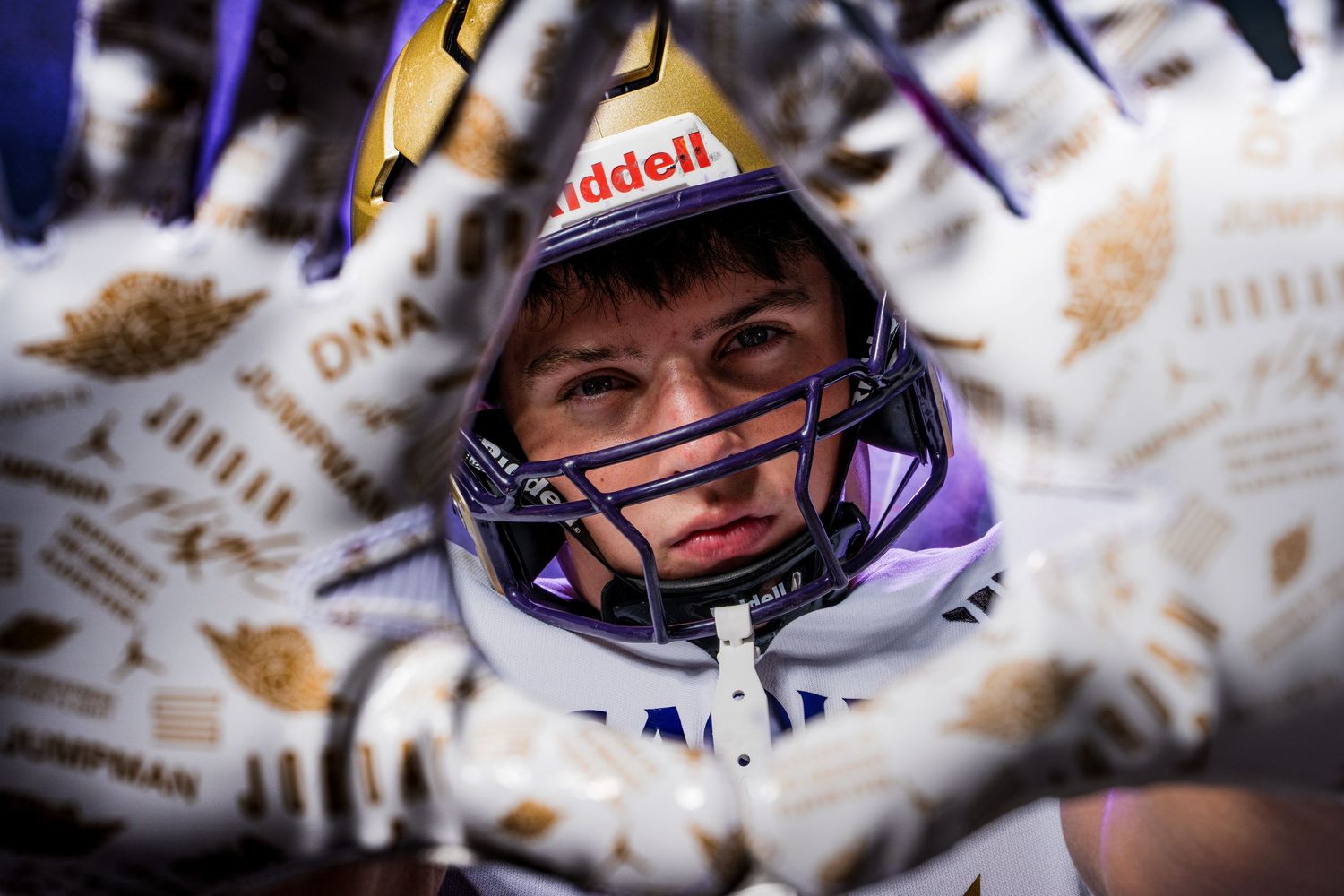 A series of six photos showing an astronaut in a spacesuit with different facial expressions through a helmet visor.