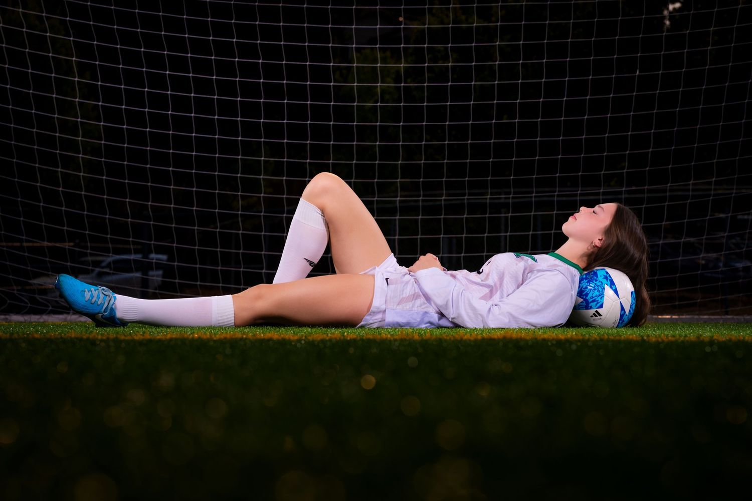 A series of seven similar photos showing someone lying on grass in a relaxed pose against a dark background.
