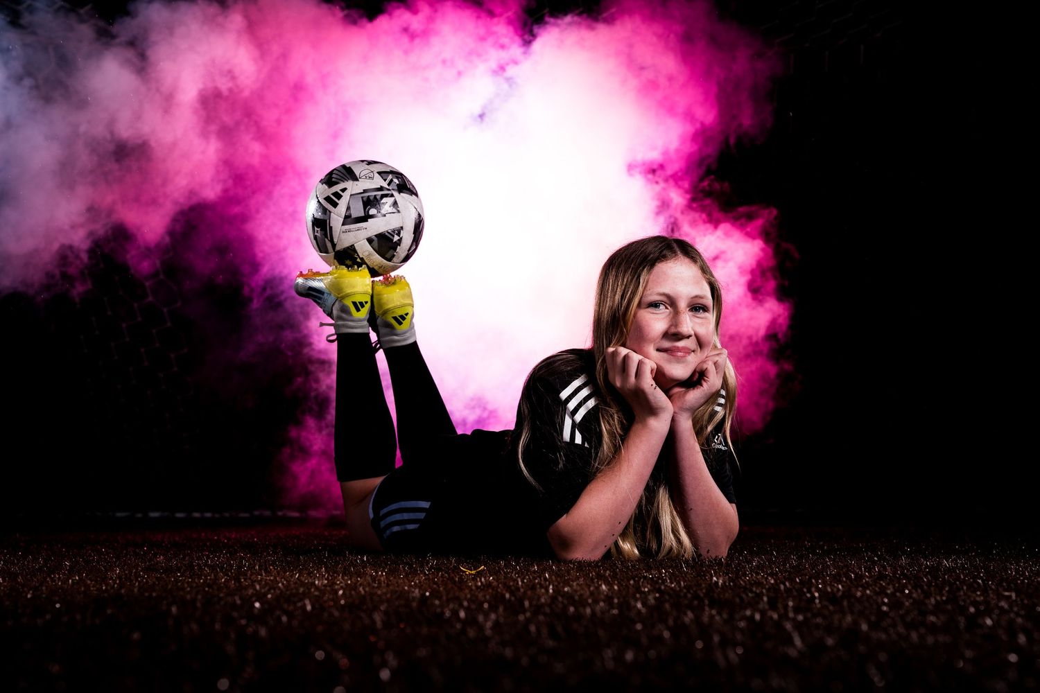 A dramatic portrait series with pink smoke effects shows someone posing against a dark background.