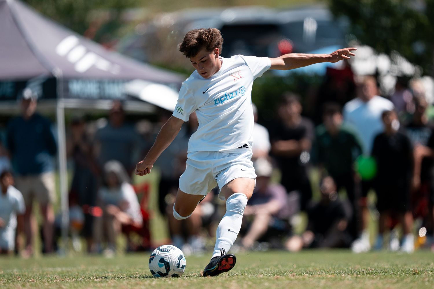 A XF soccer player kicks the game winning shot in the 2025 ECNL Championship game photographed by Carlos Sanchez Photography in Seattle