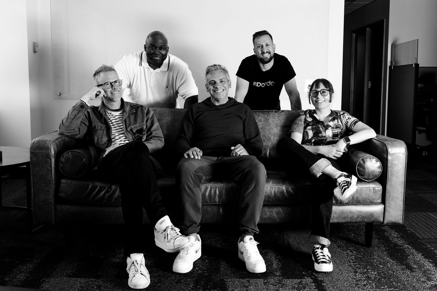 A game development team poses for a team photo during a corporate headshot session shot by Carlos Sanchez Photography in Seattle.