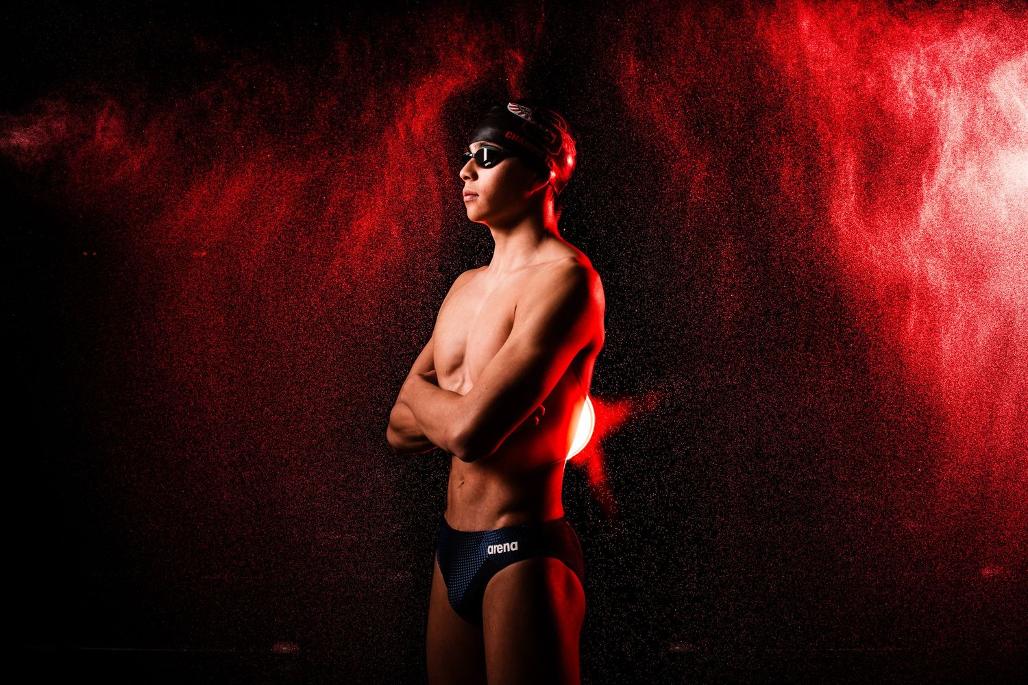 Dramatic black and white artistic nude photographs with red lighting effects against a dark textured background.