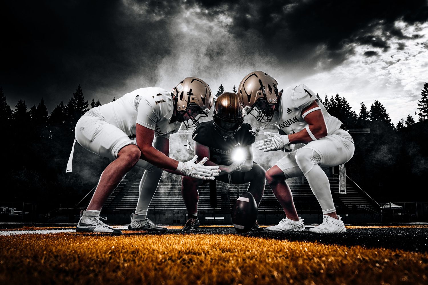 Dramatic low-angle shots of people in selective color against a moody sky.