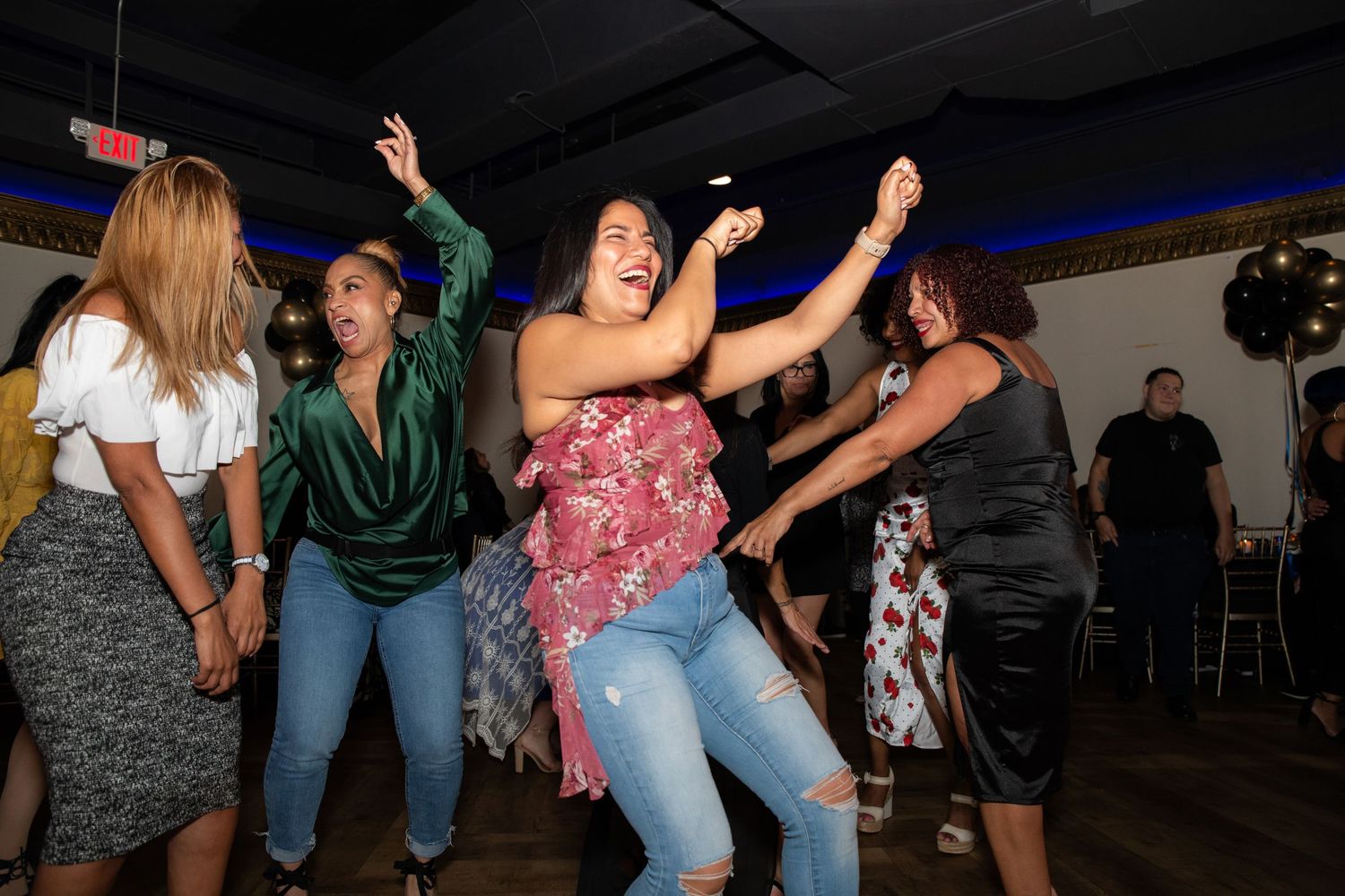 A group of women dancing and having fun at a 50th birthday party in Rutherford, NJ