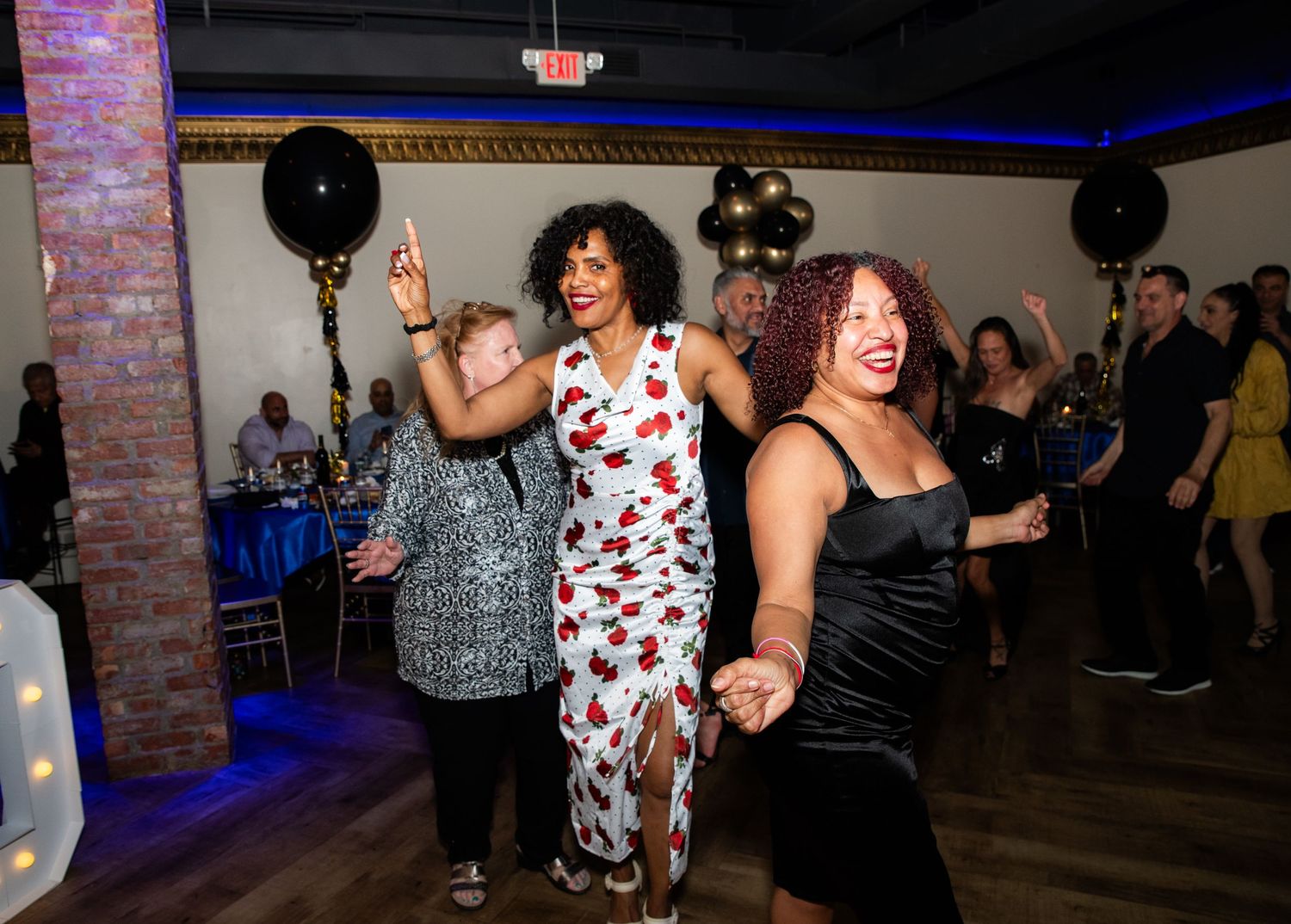 A group of women dancing and having fun at a 50th birthday party in Rutherford, NJ
