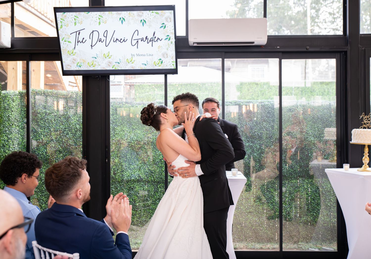 A bride and groom kiss after being married in Bayonne, NJ