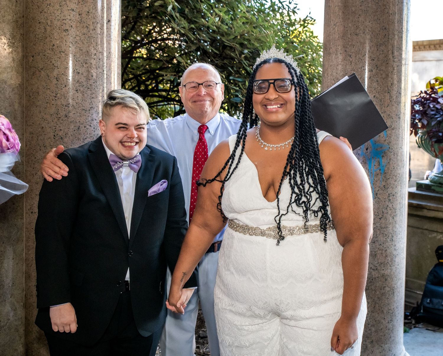 The happy couple faces their guests after being married in a gazebo in Brooklyn, NY