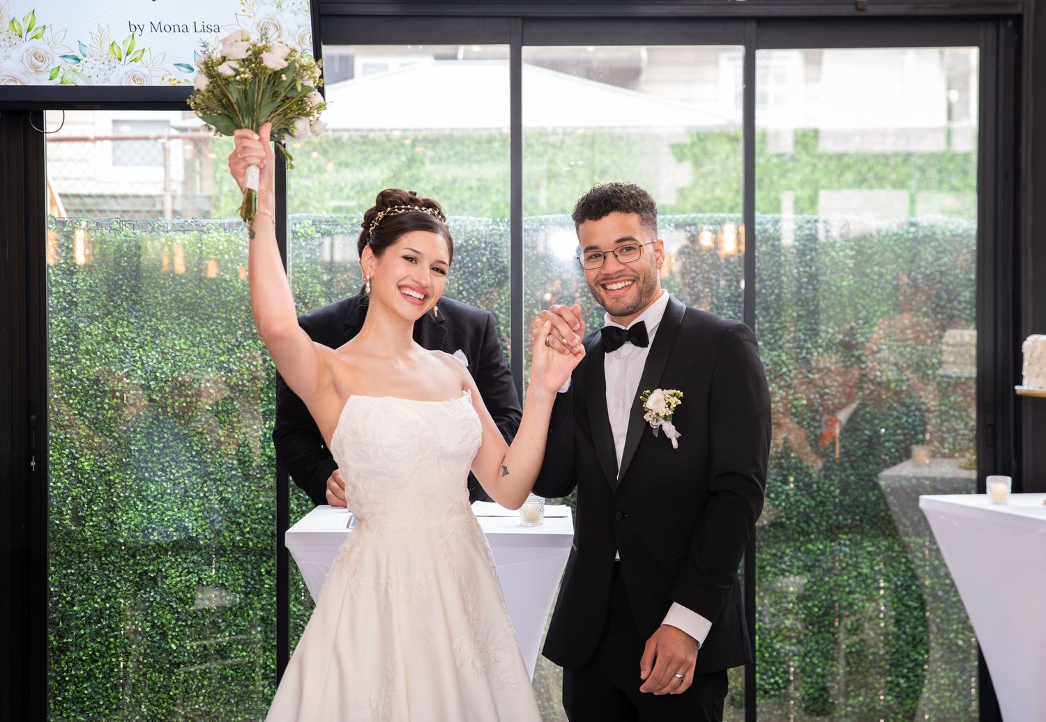 A bride and groom turn to face their guests after they are just married with smiles on their faces in Bayonne, NJ
