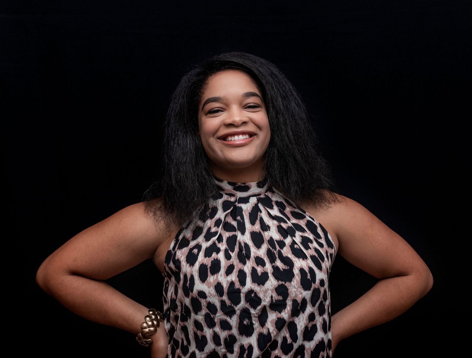 A woman posing for a portrait at a 60th birthday celebration in Montclair, NJ