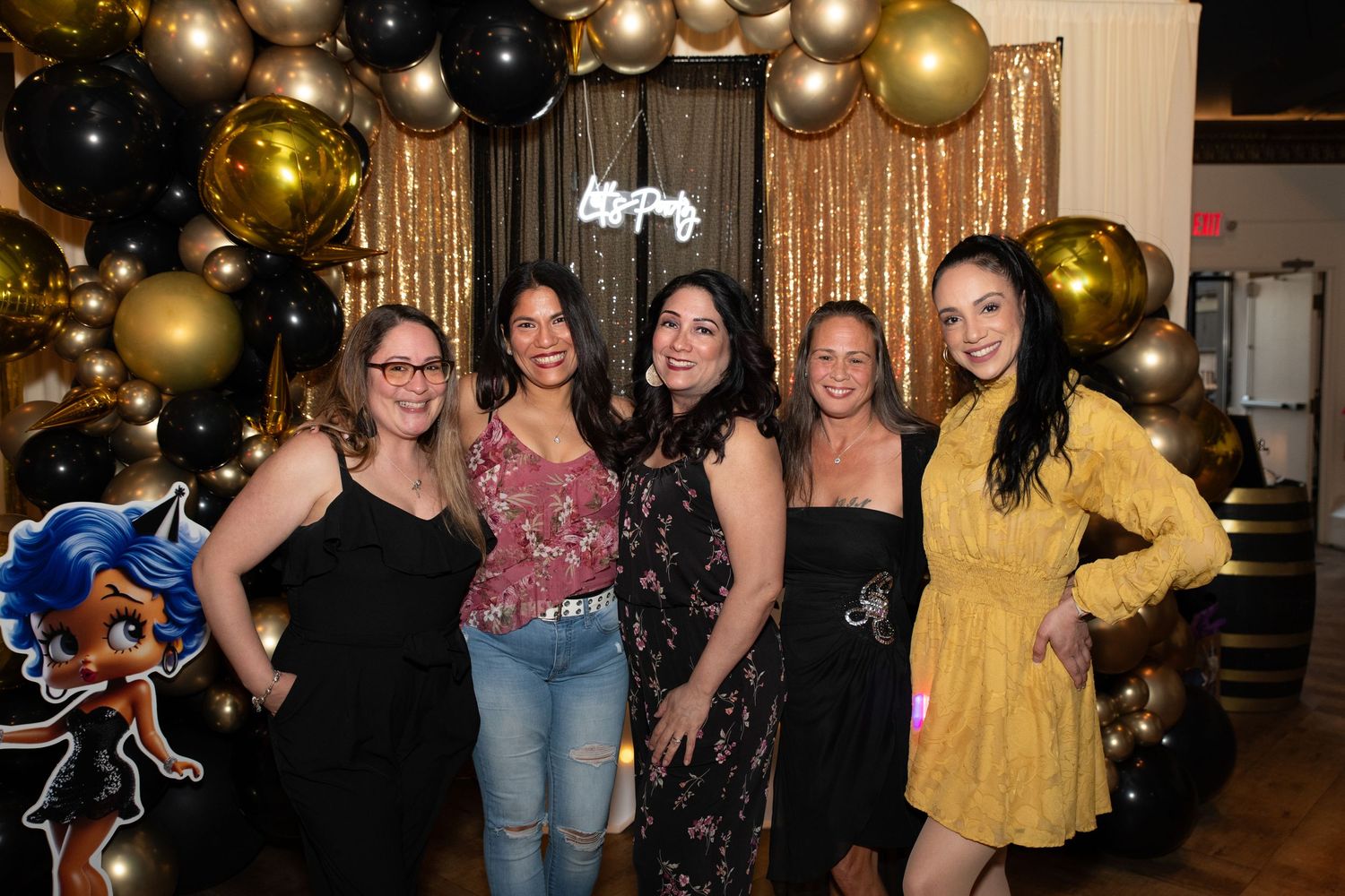 Five women posing for a photo and a 50th birthday party in Rutherford, NJ