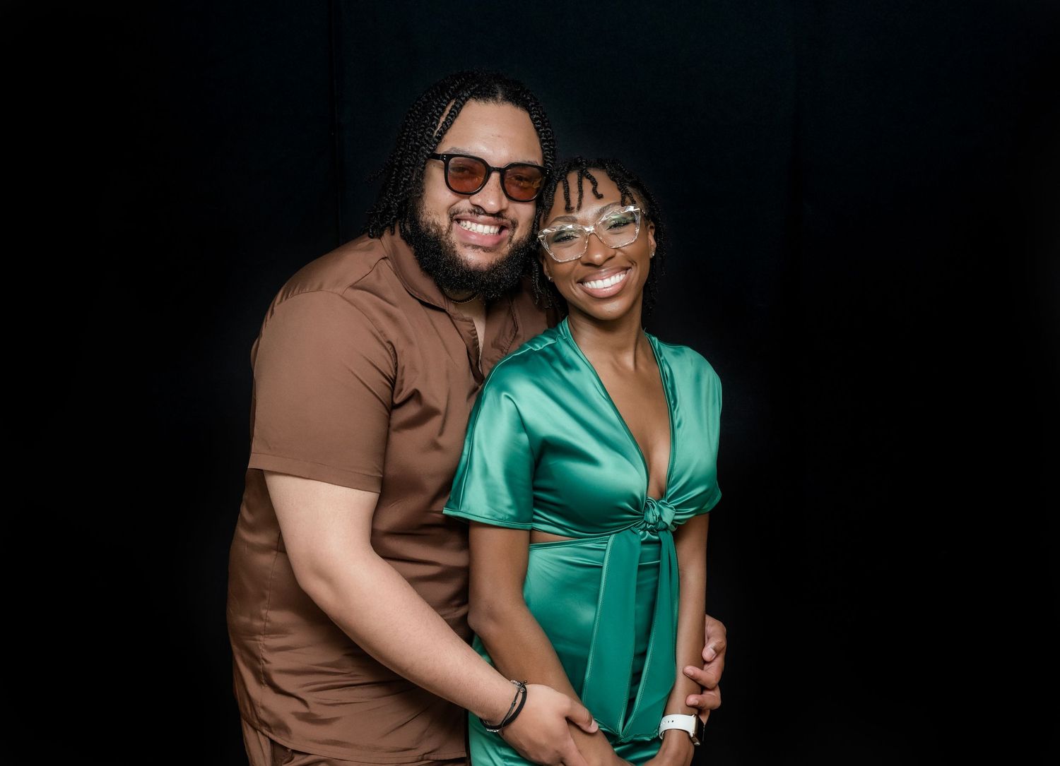 A man and a woman pose for a portrait and smile at a college graduation party in Hewitt, NJ