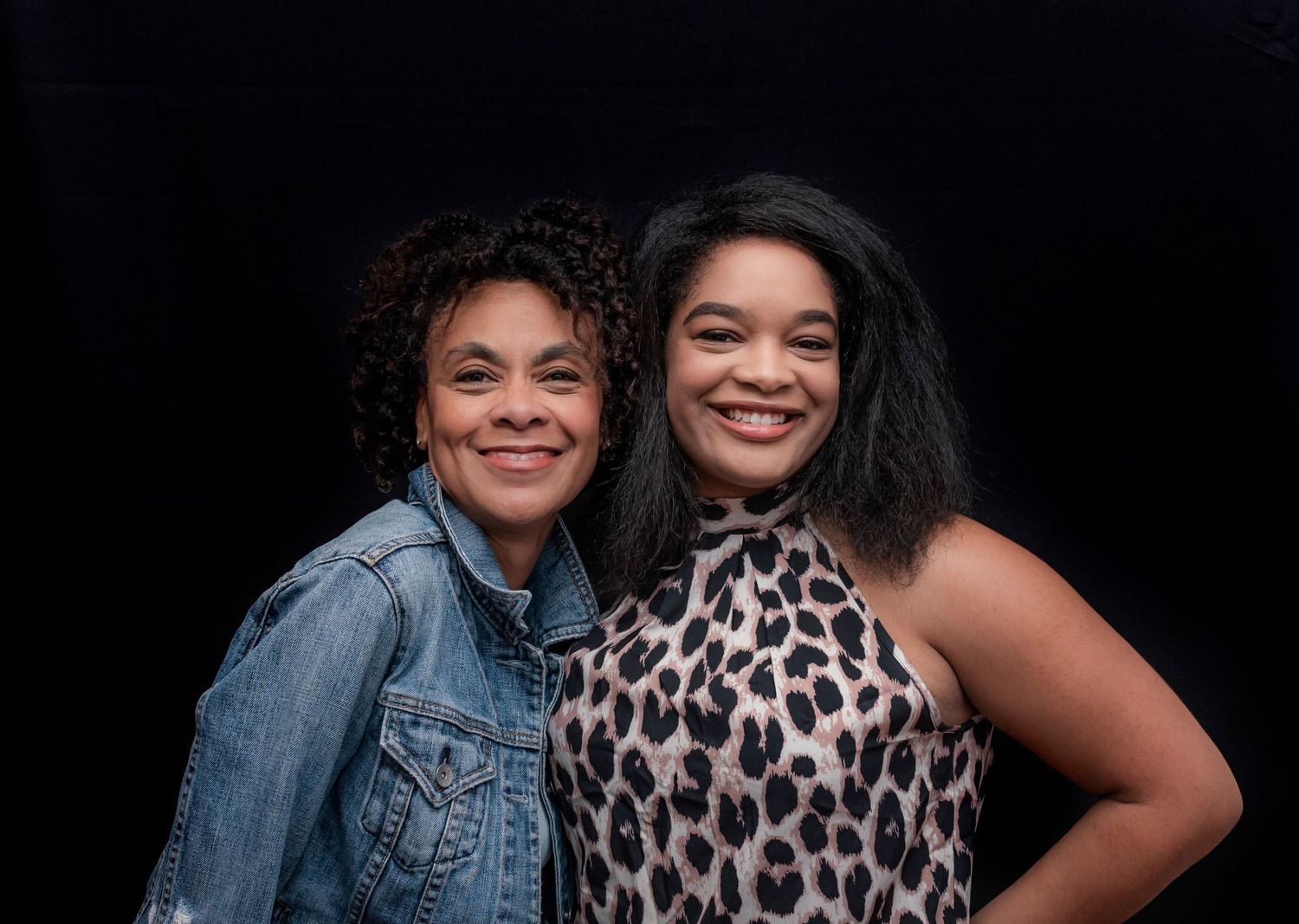 Two women posing and smiling for a portrait at a 60th birthday party in Montclair, NJ