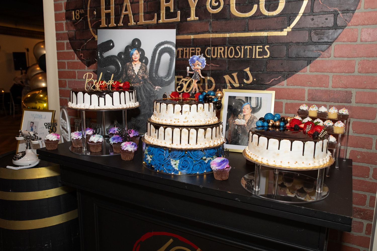 A photo of the dessert table and birthday cake for a 50th birthday party in Rutherford, NJ