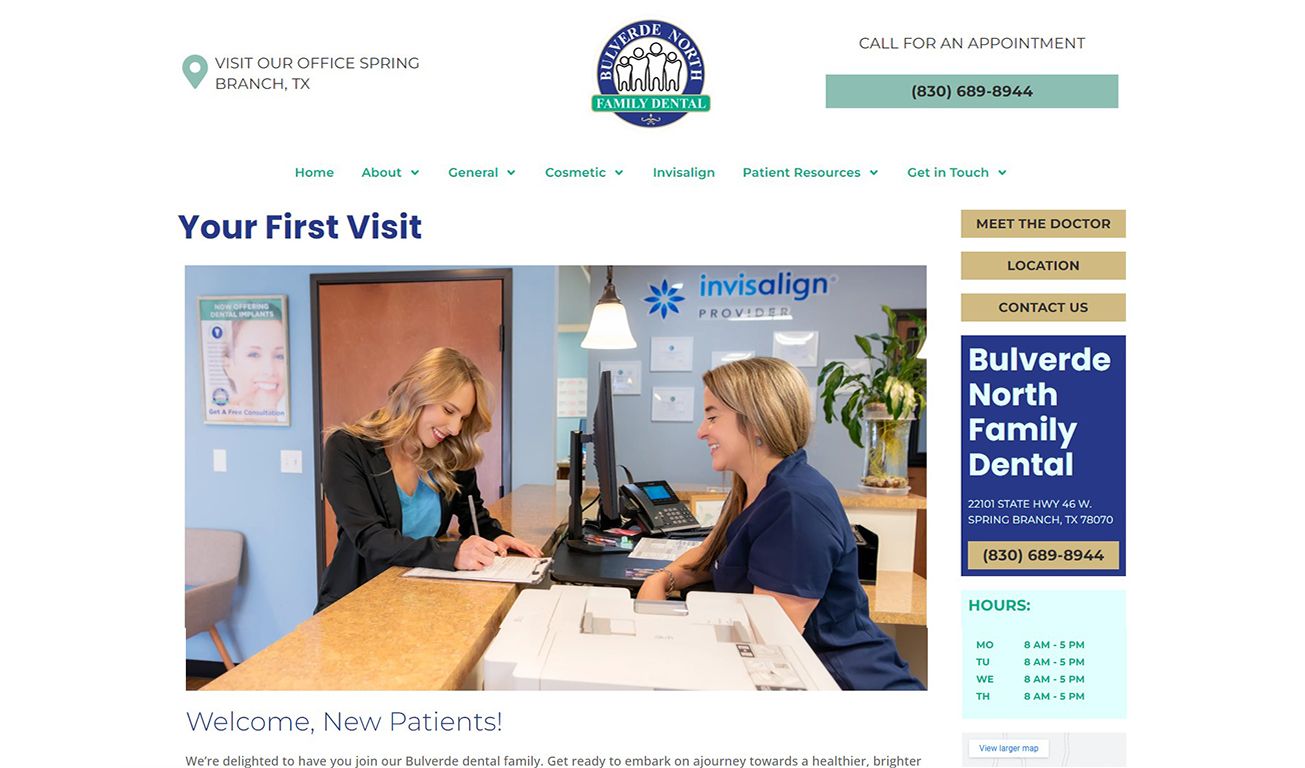 Bulverde North Family Dental office reception area with staff member assisting patient at front desk with Invisalign display.