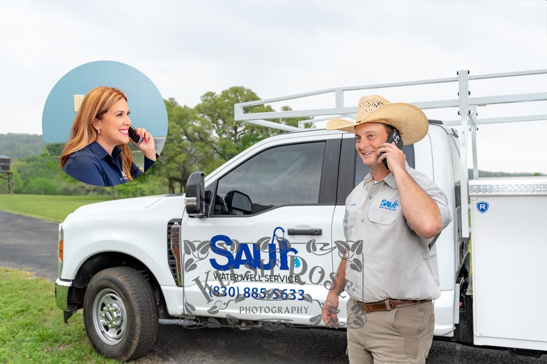 Saul Water Well Service technician talking on phone to receptionist by branded company truck in Texas Hill Country.