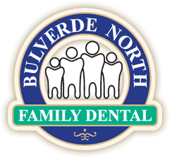 Bulverde North Family Dental circular logo with family tooth icons on navy blue background.