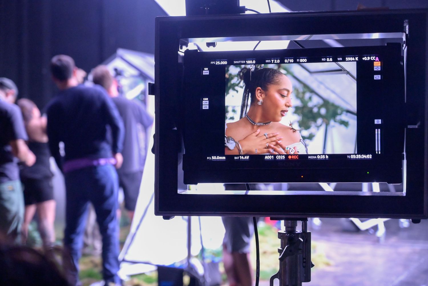 Multiple video production monitors showing different camera angles during filming.