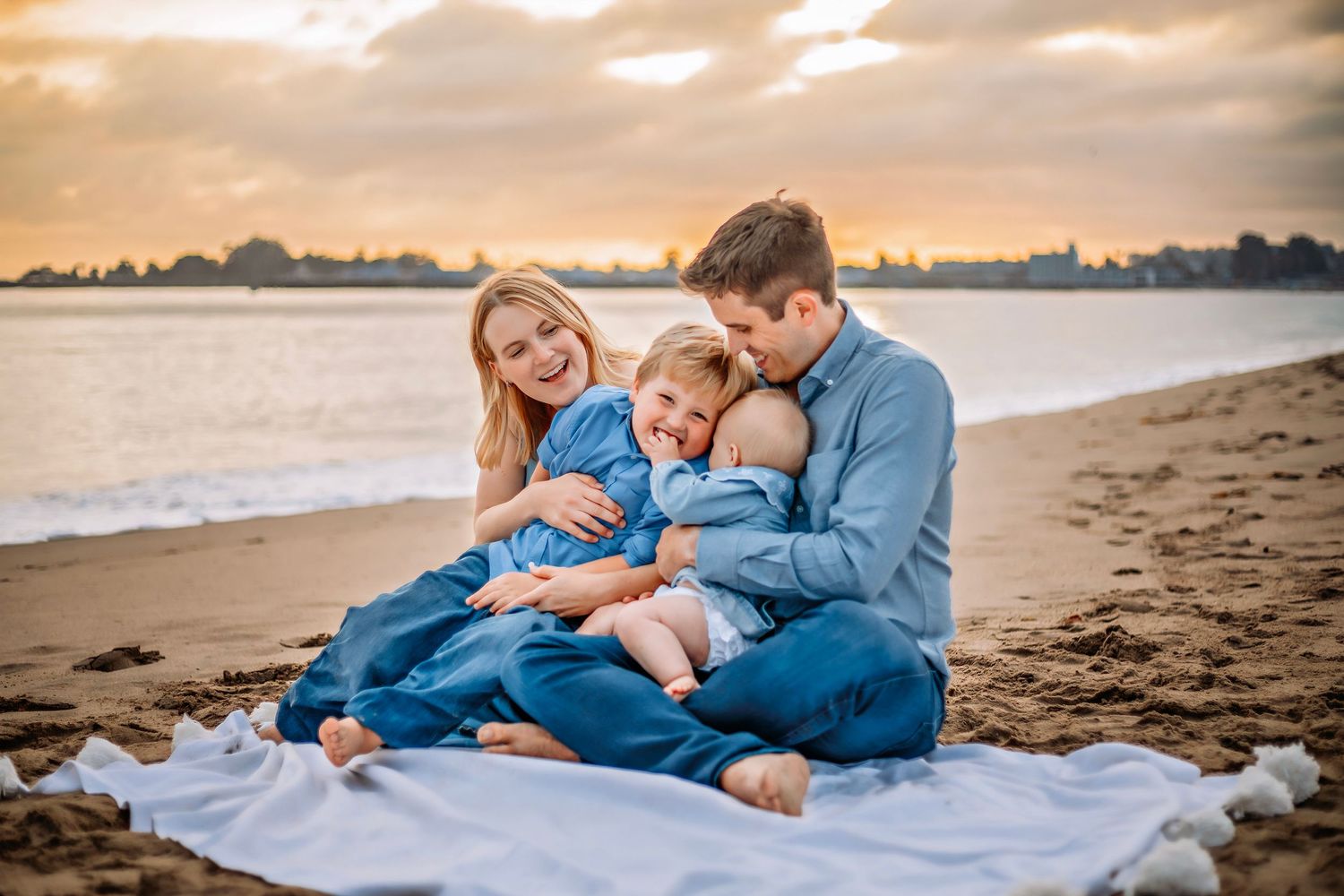 Family enjoying at the beach in Santa Cruz, captured in natural light with candid moments, ocean views, and a relaxed coastal setting