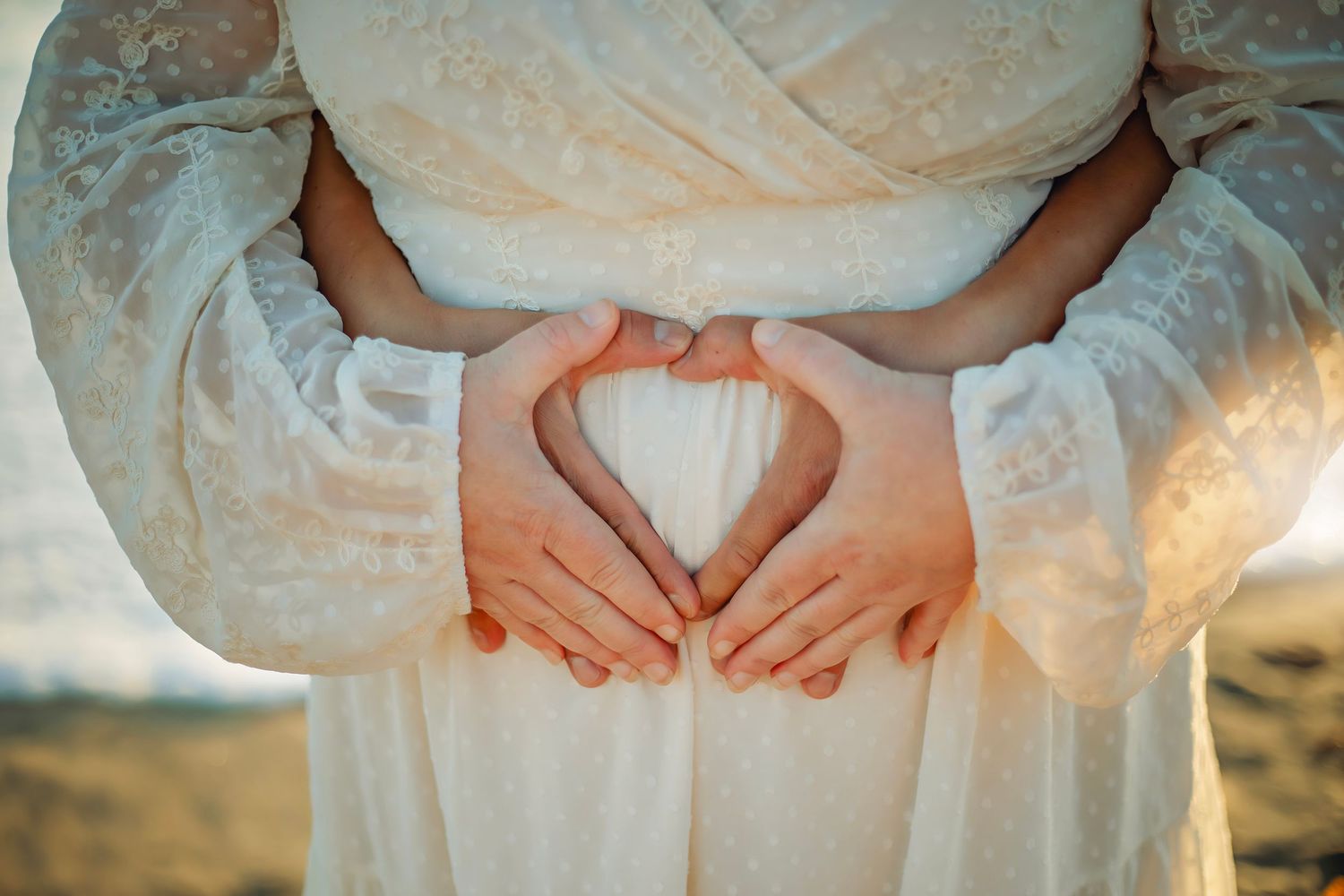 Family maternity photo session at a Santa Cruz beach, candid moments, ocean views, and a warm, relaxed coastal atmosphere.