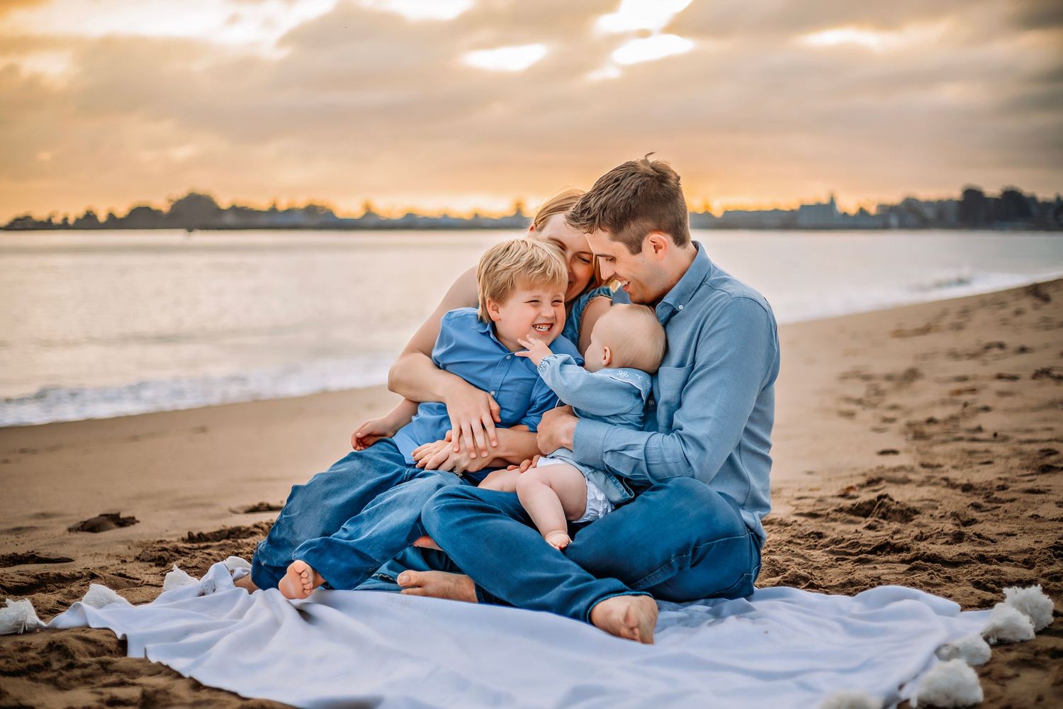 Family enjoying at the beach in Santa Cruz, captured in natural light with candid moments, ocean views, and a relaxed coastal setting