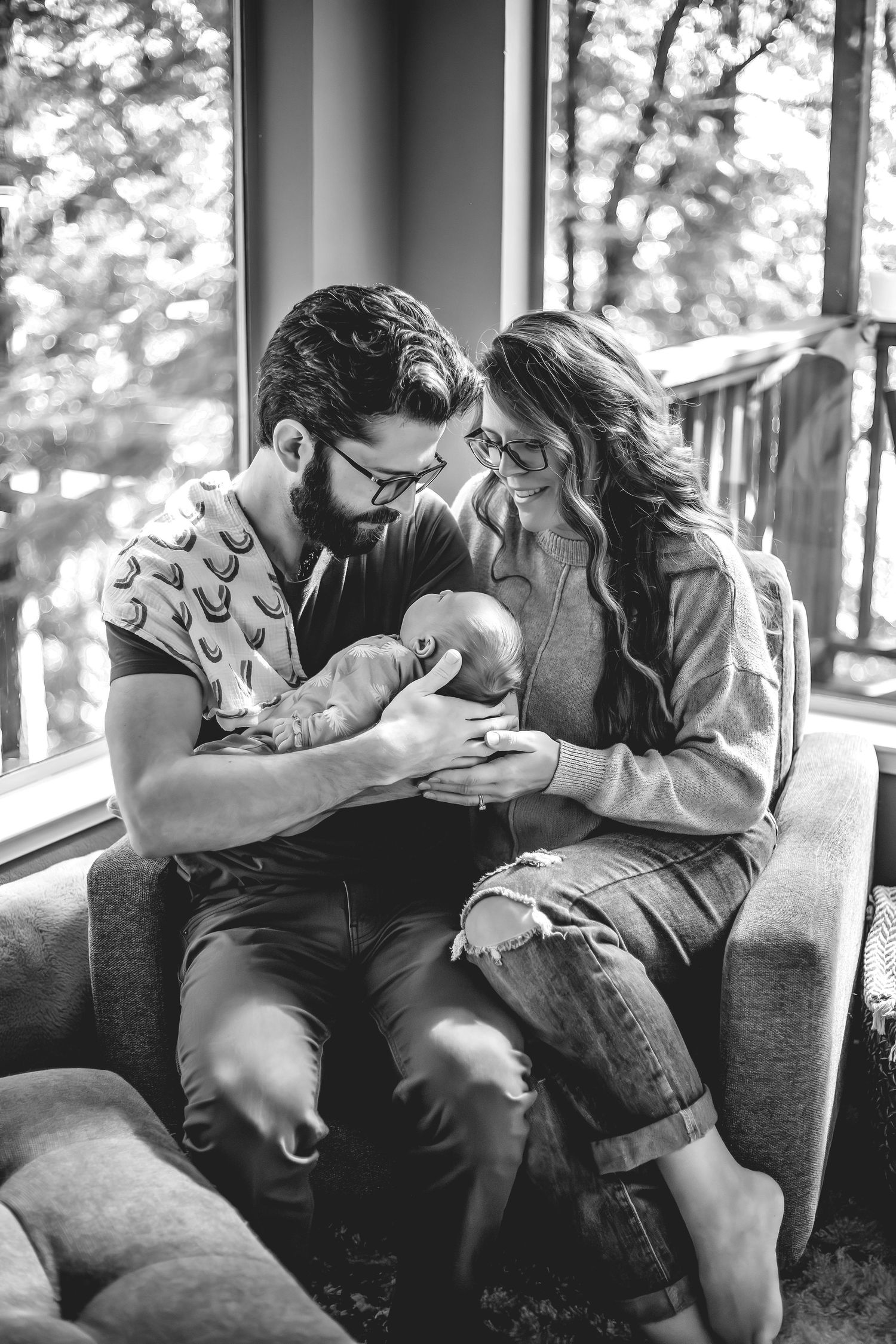 At-home newborn photo session in Santa Cruz, capturing a family’s intimate, candid moments with warmth and heartfelt connection