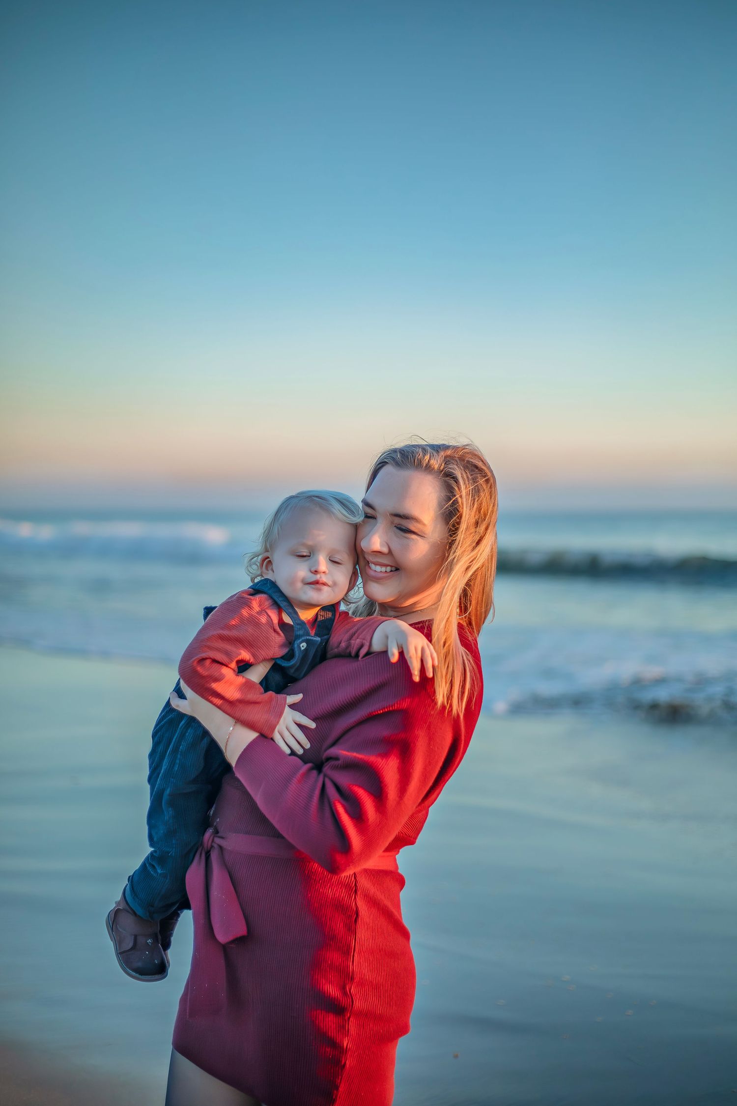 Family enjoying at the beach in Santa Cruz, captured in natural light with candid moments, ocean views, and a relaxed coastal setting
