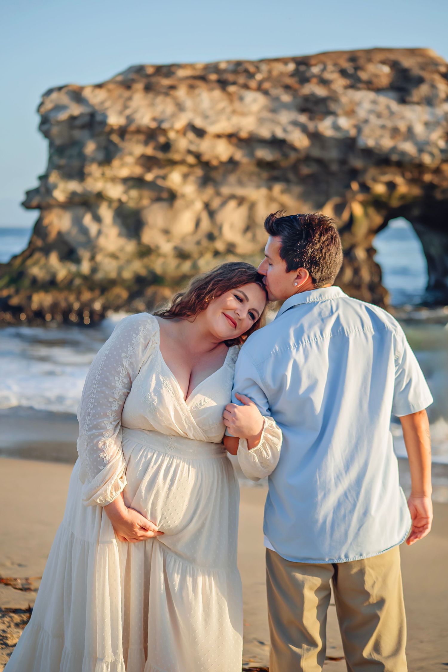 Family maternity photo session at a Santa Cruz beach, candid moments, ocean views, and a warm, relaxed coastal atmosphere.