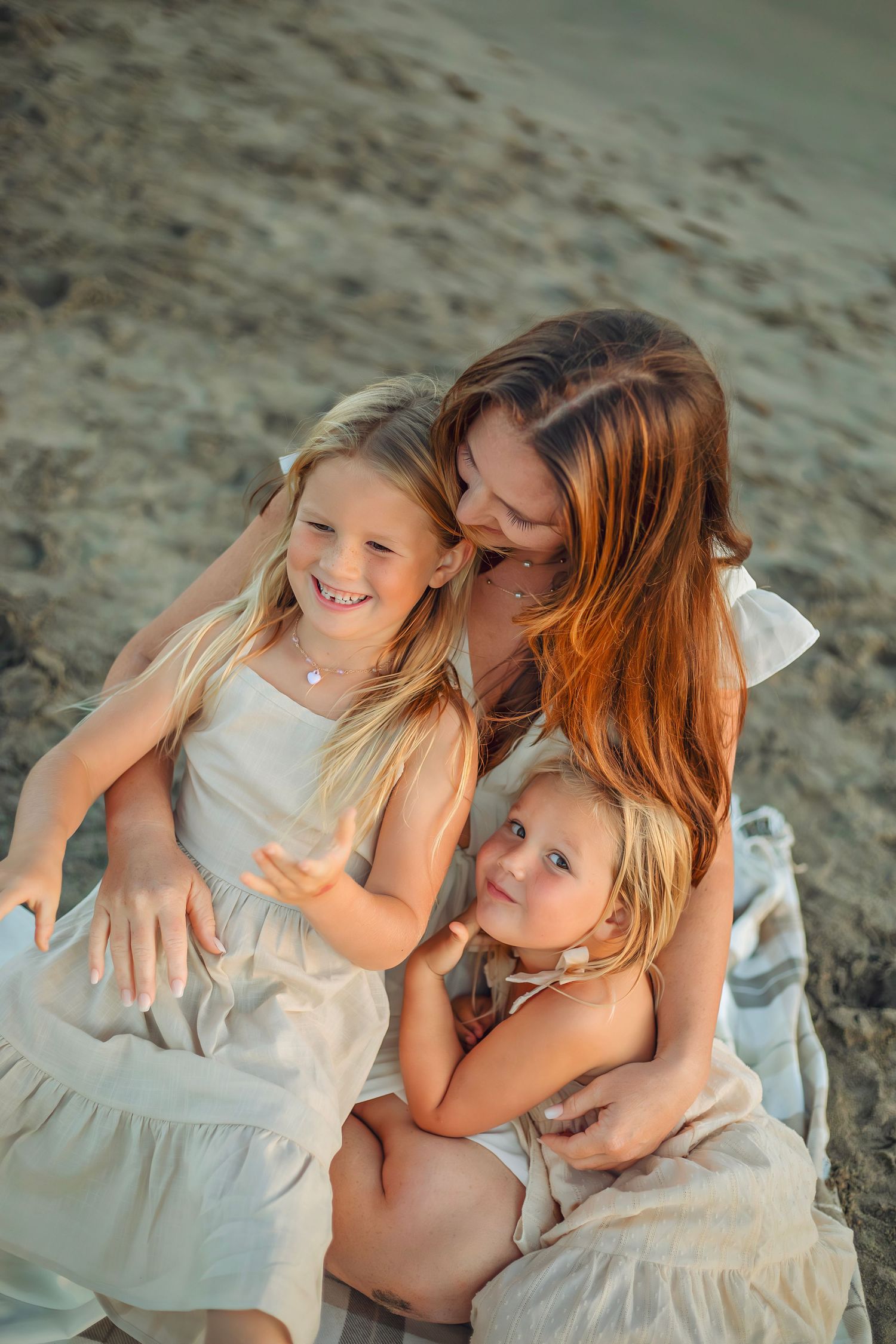 Family enjoying at the beach in Santa Cruz, captured in natural light with candid moments, ocean views, and a relaxed coastal setting