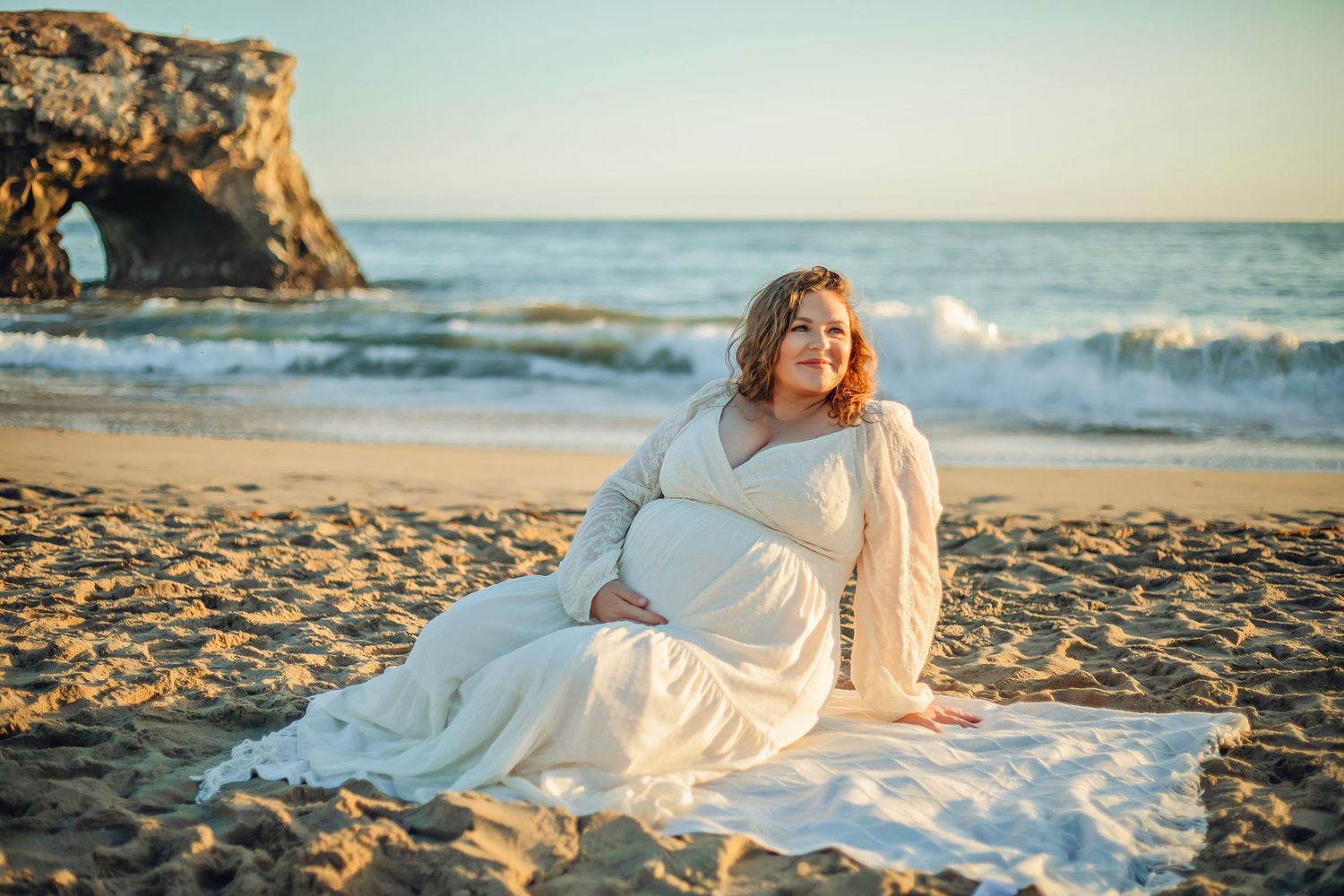 maternity photo session at a Santa Cruz beach, candid moments, ocean views, and a warm, relaxed coastal atmosphere.