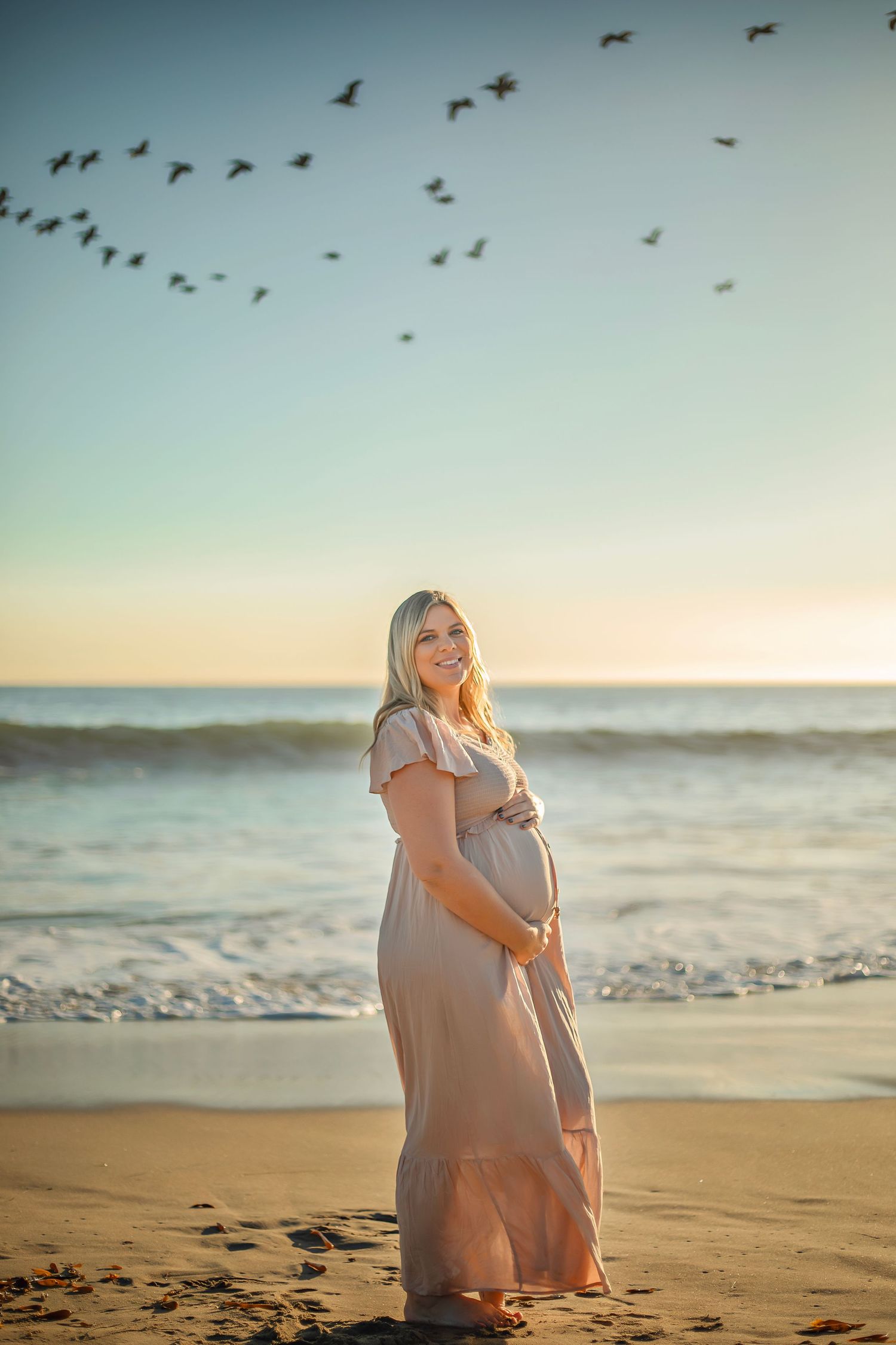 maternity photo session at a Santa Cruz beach, candid moments, ocean views, and a warm, relaxed coastal atmosphere.