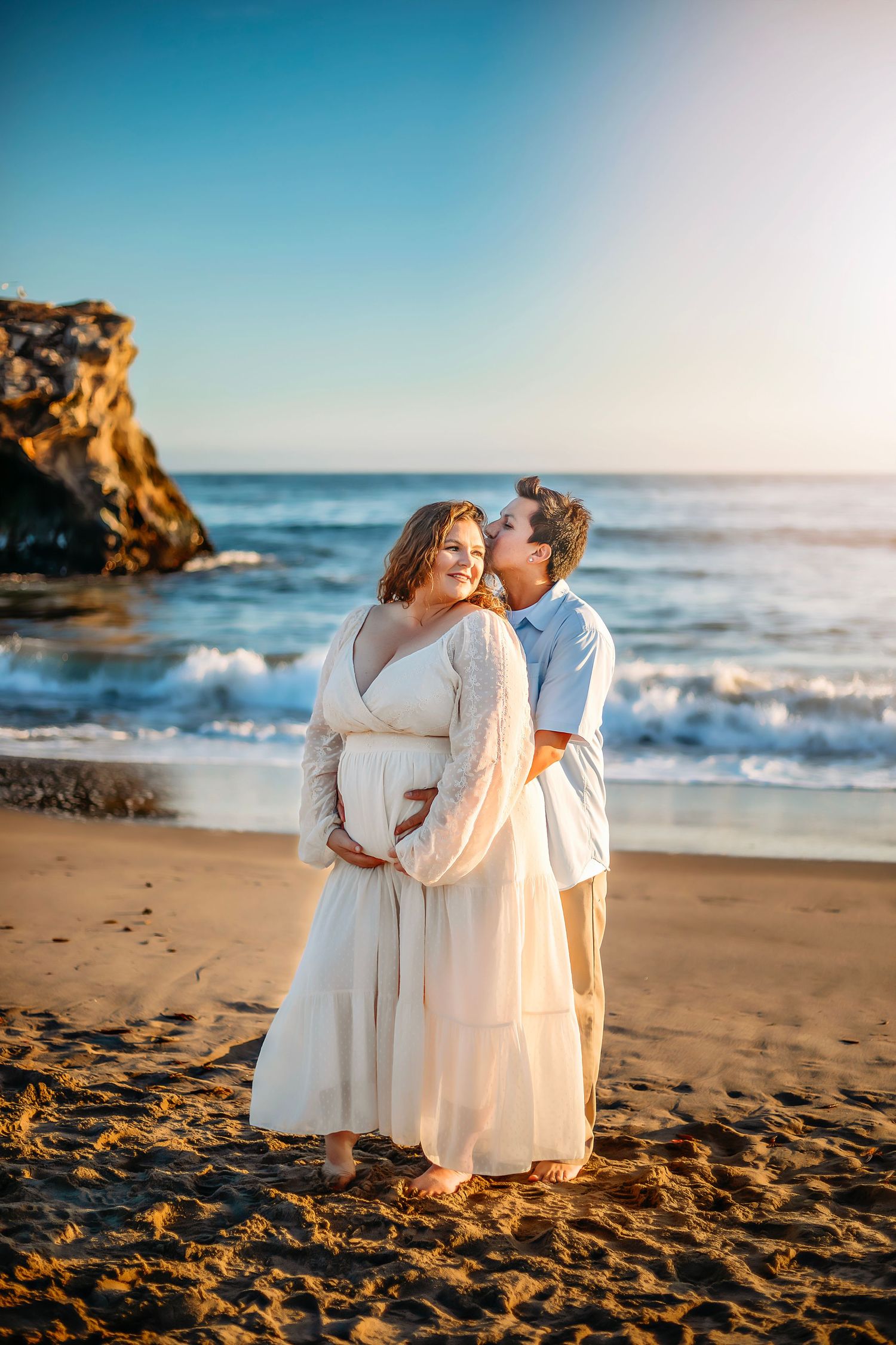 Family maternity photo session at a Santa Cruz beach, candid moments, ocean views, and a warm, relaxed coastal atmosphere.