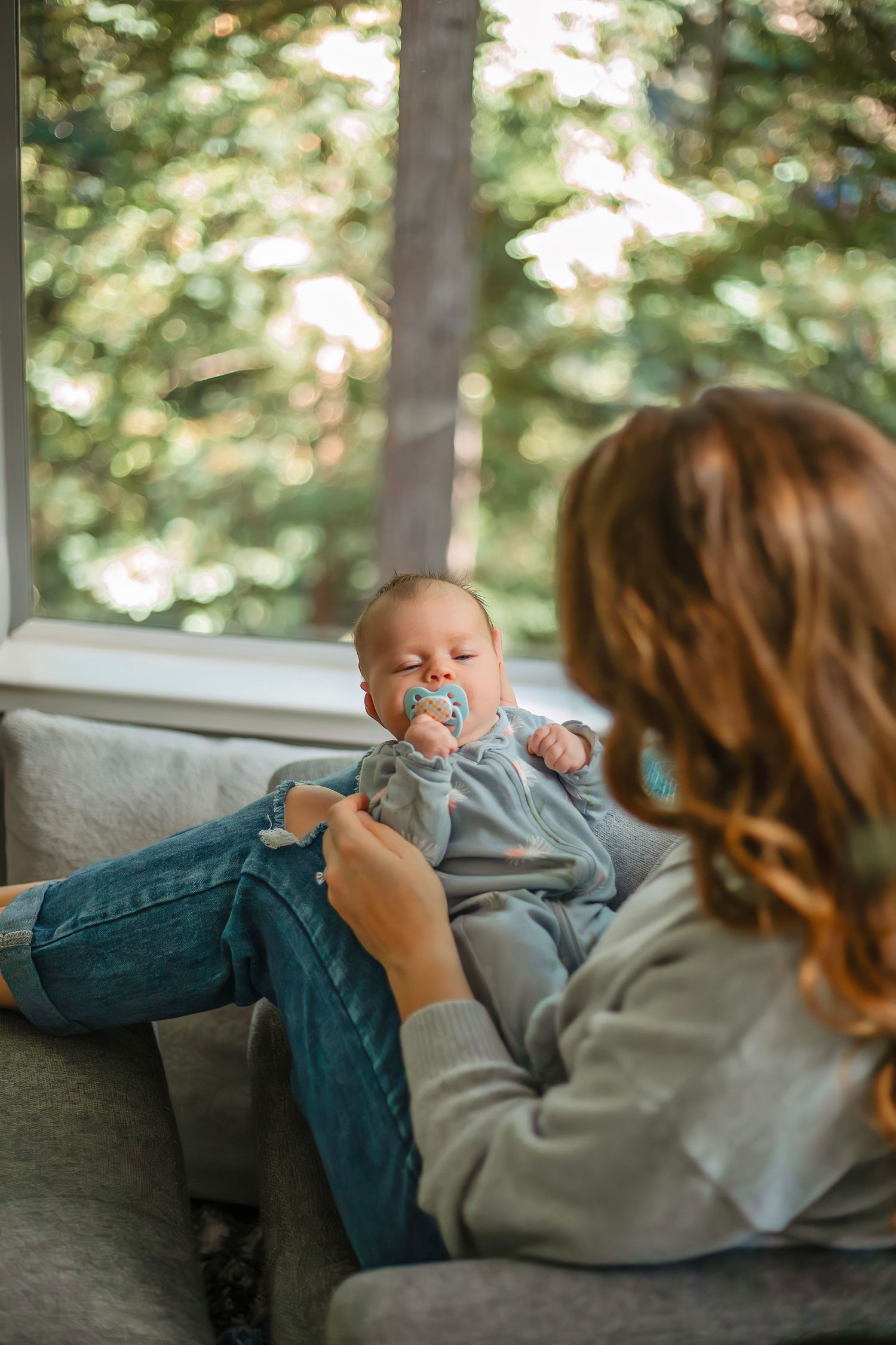 At-home newborn photo session in Santa Cruz, capturing a family’s intimate, candid moments with warmth and heartfelt connection