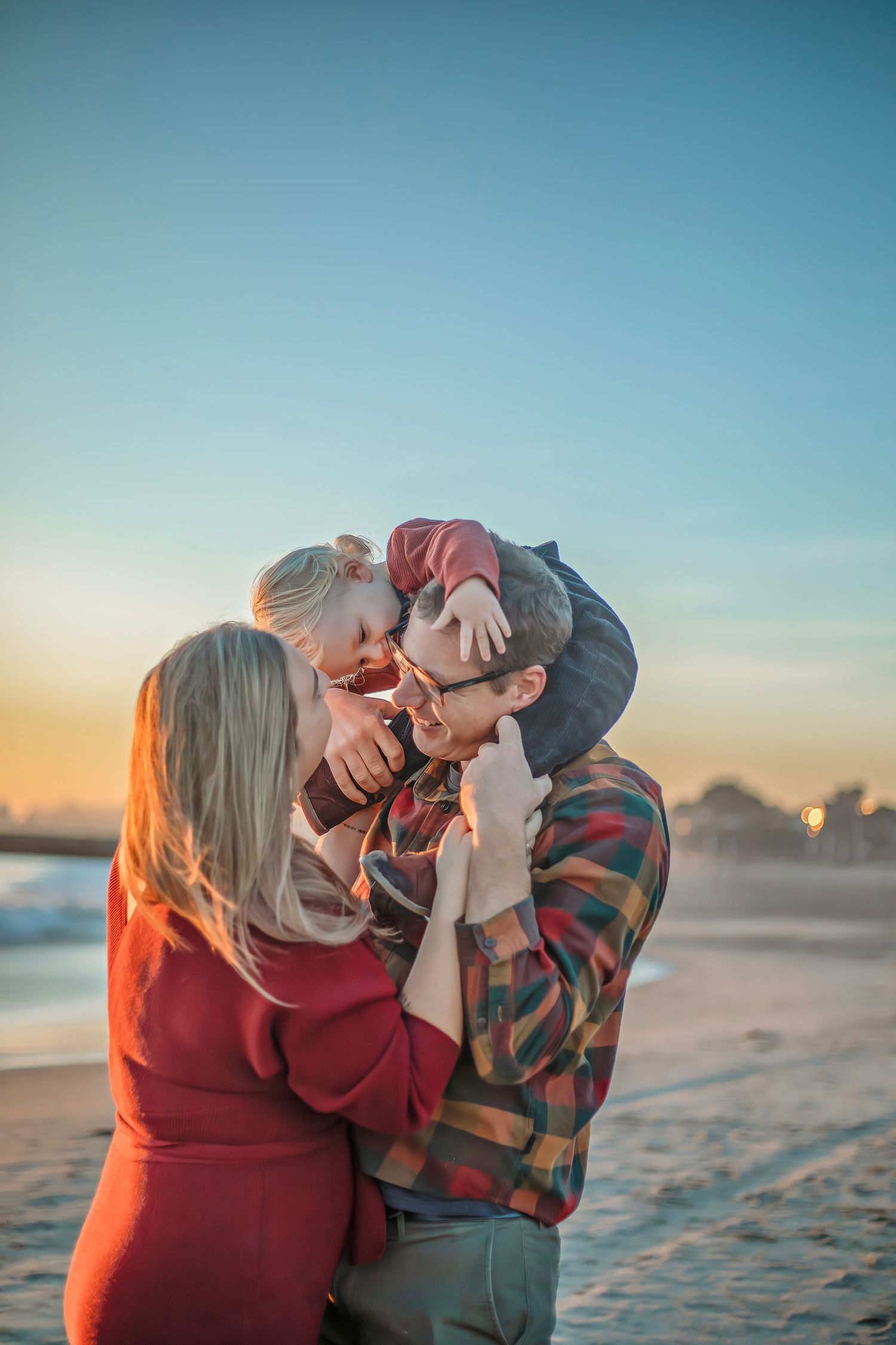 Candid family moment at a beach in Santa Cruz, CA in fall outfits during fall mini session