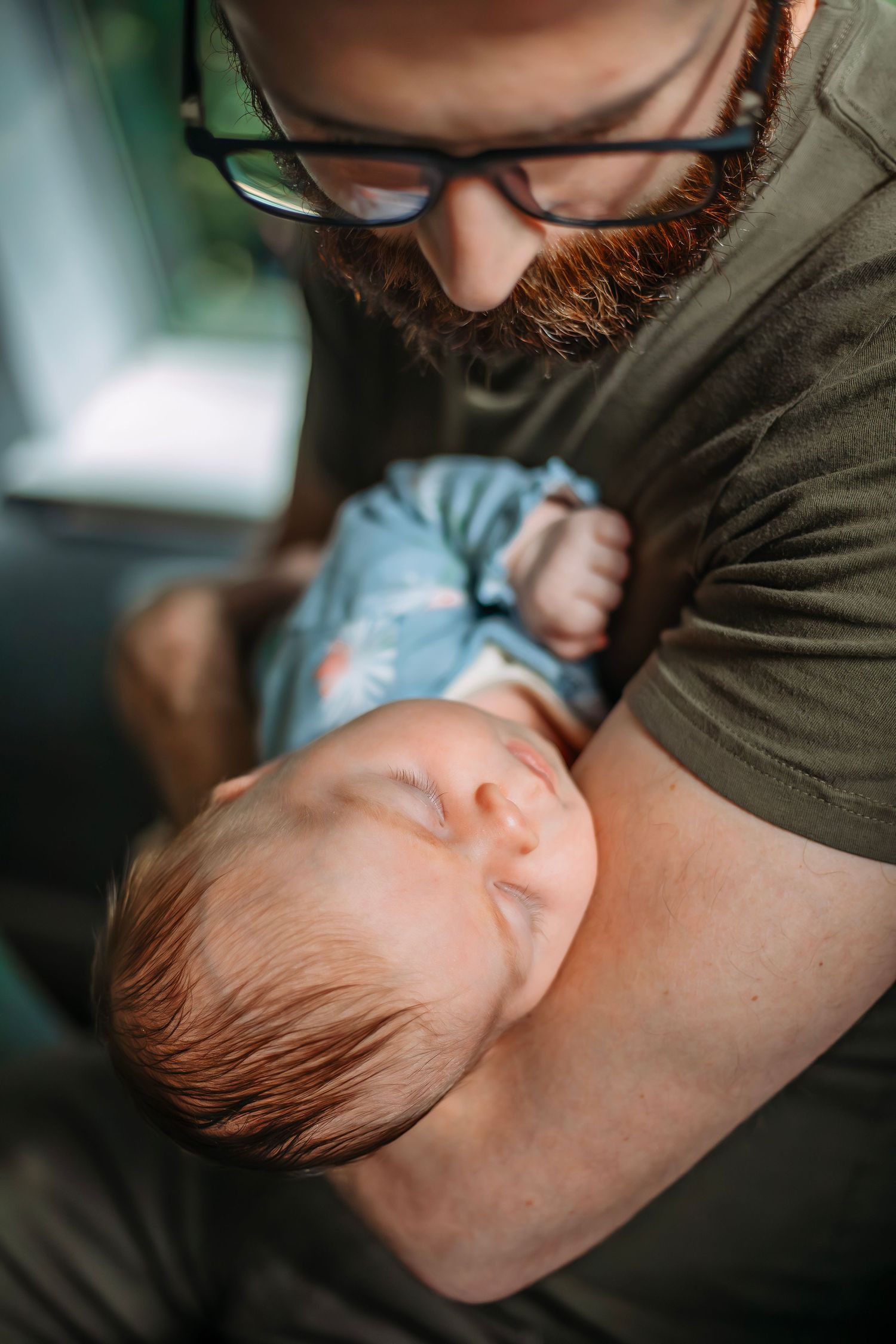 At-home newborn photo session in Santa Cruz, capturing a family’s intimate, candid moments with warmth and heartfelt connection