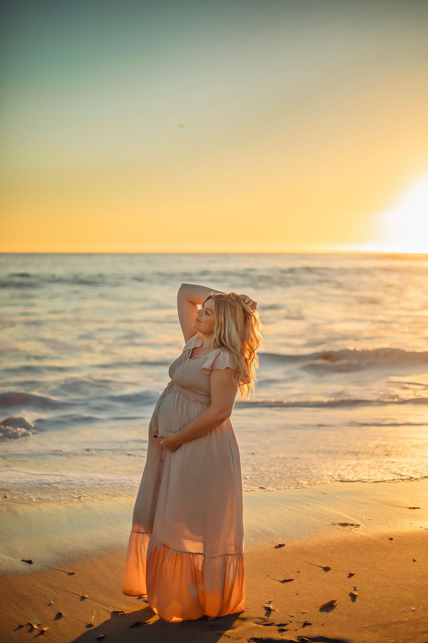 maternity photo session at a Santa Cruz beach, candid moments, ocean views, and a warm, relaxed coastal atmosphere.