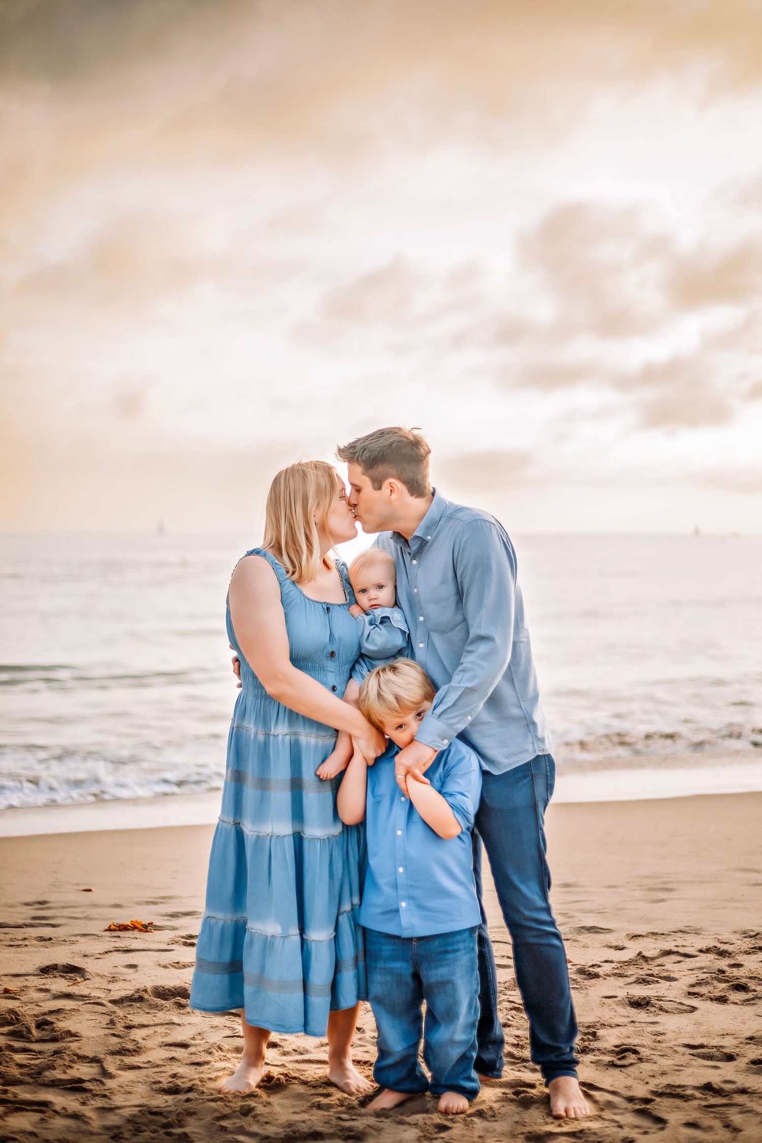 Family enjoying at the beach in Santa Cruz, captured in natural light with candid moments, ocean views, and a relaxed coastal setting