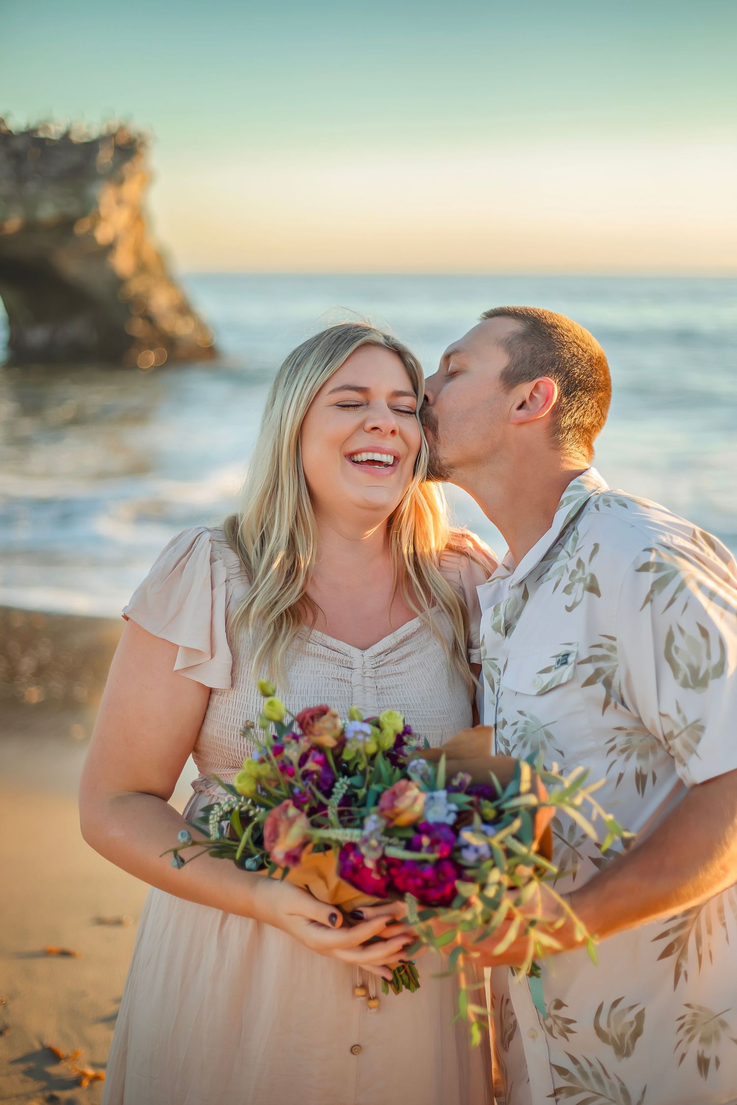 Family maternity photo session at a Santa Cruz beach, candid moments, ocean views, and a warm, relaxed coastal atmosphere.